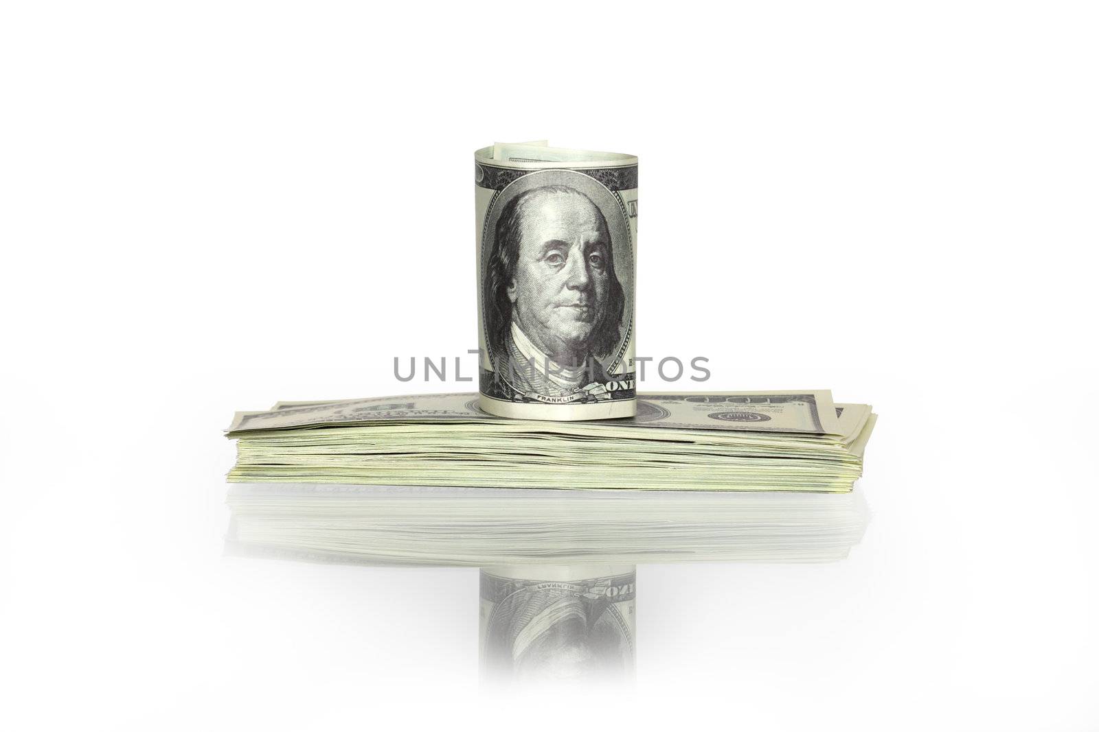 One hundred dollars note standing on stack of banknotes. Isolated with clipping path