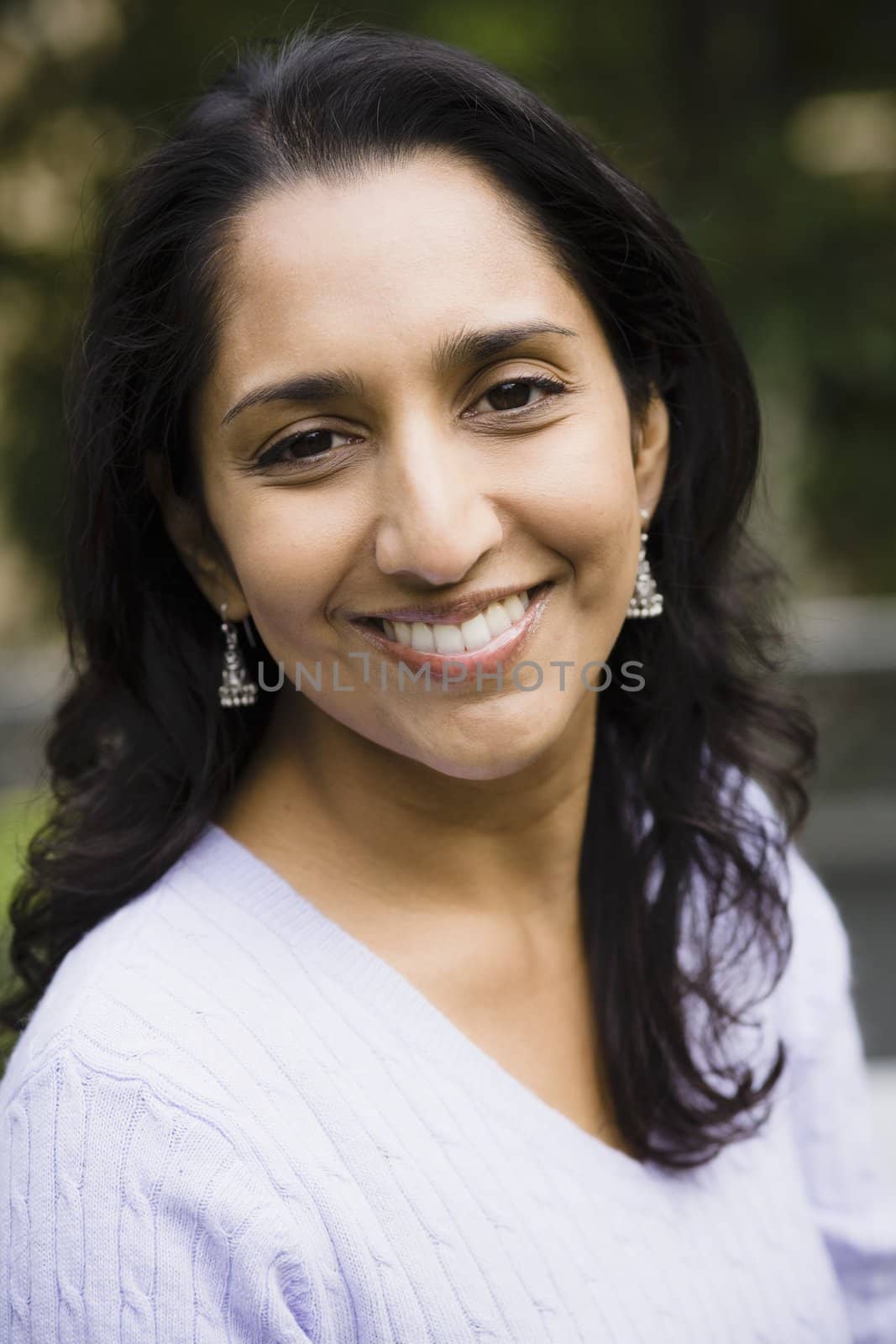 Portrait of a Smiling Indian Woman Outdoors