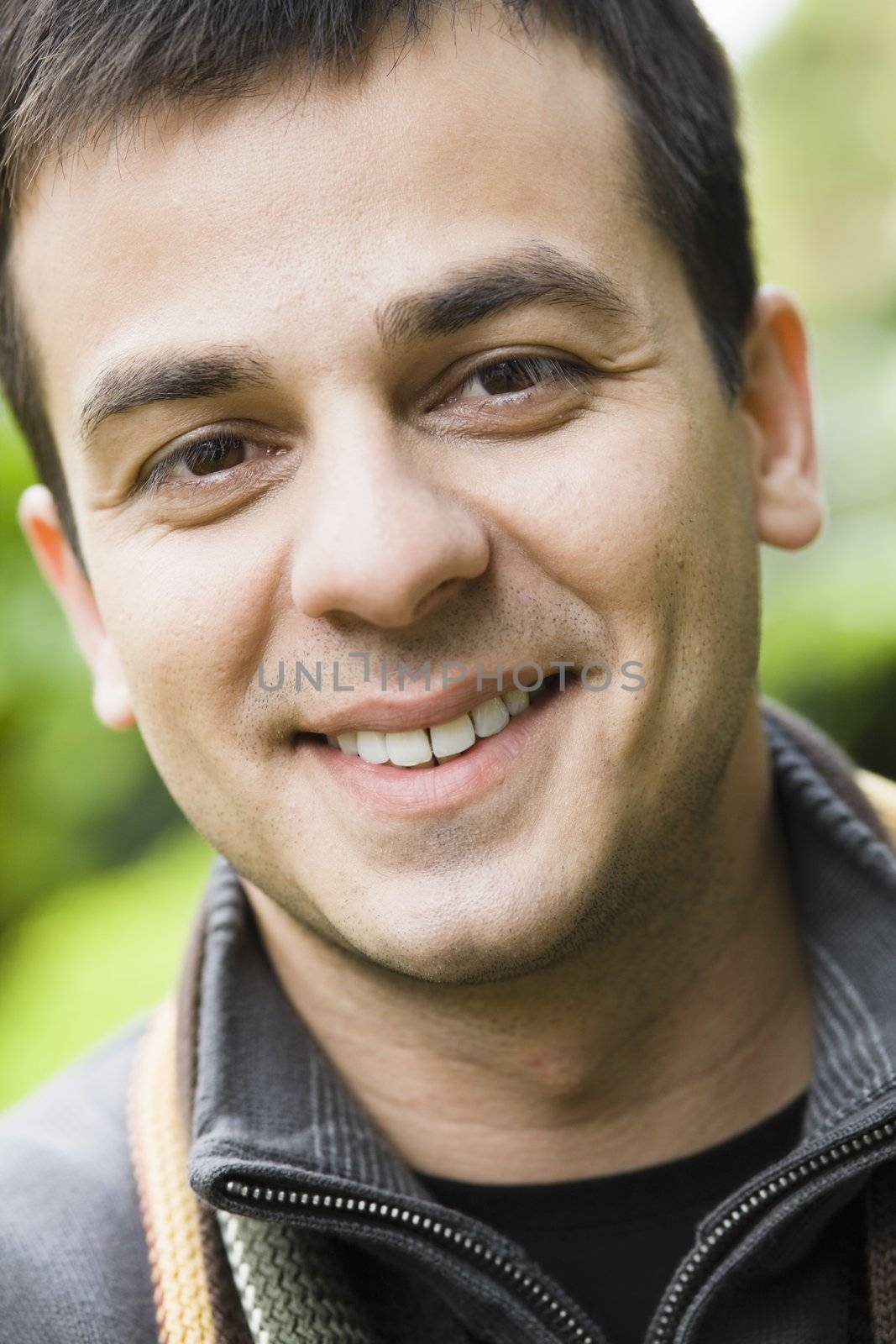 Portrait of a Smiling Indian Male Outdoors
