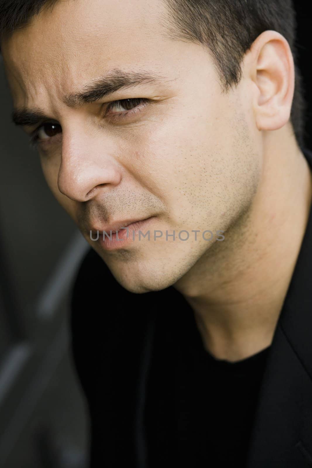 Portrait of a Serious Indian Male Looking Directly To Camera