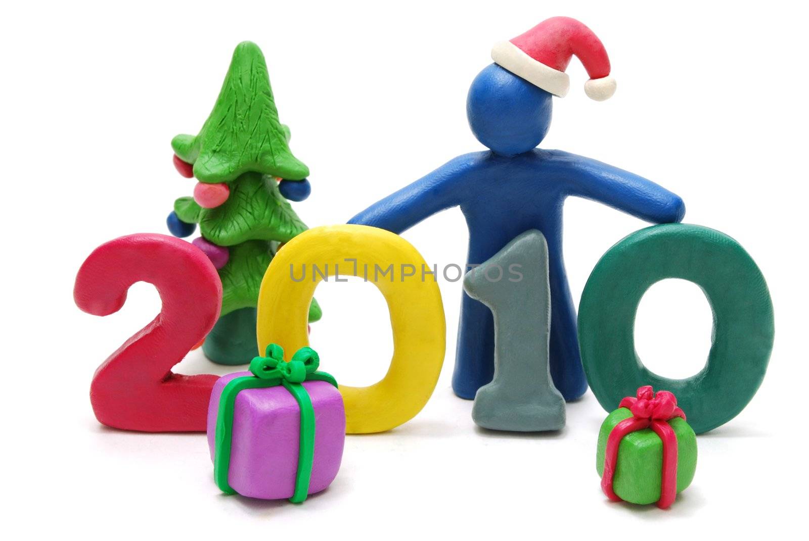3D New Year Text 2010 Made of Colored Plasticine with Christmas Gifts and Tree Isolated on White Background