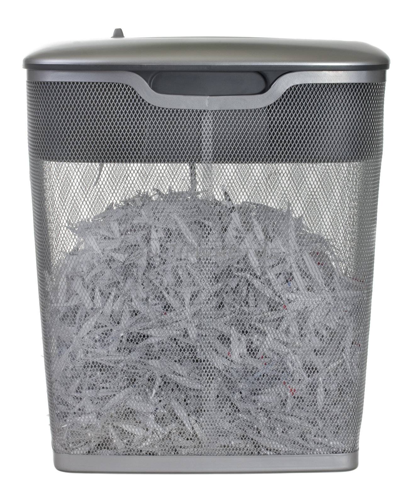 light duty paper shredder with metal wire basket filled with document shreddings, isolated on white