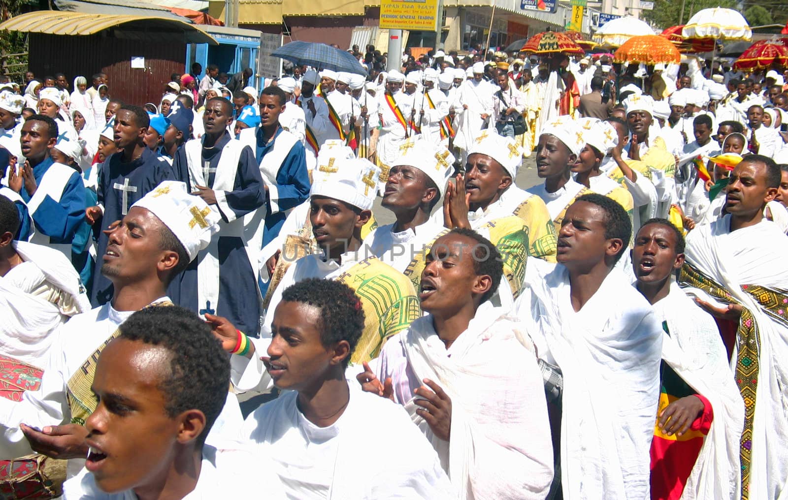 A large crowd singing and chanting while accompanying the Tabot (model of the arc of covenant) of St Michael church during Timket (baptism in Amharic) celebrations - The baptism of Jesus (Taken on January 21, 2008)