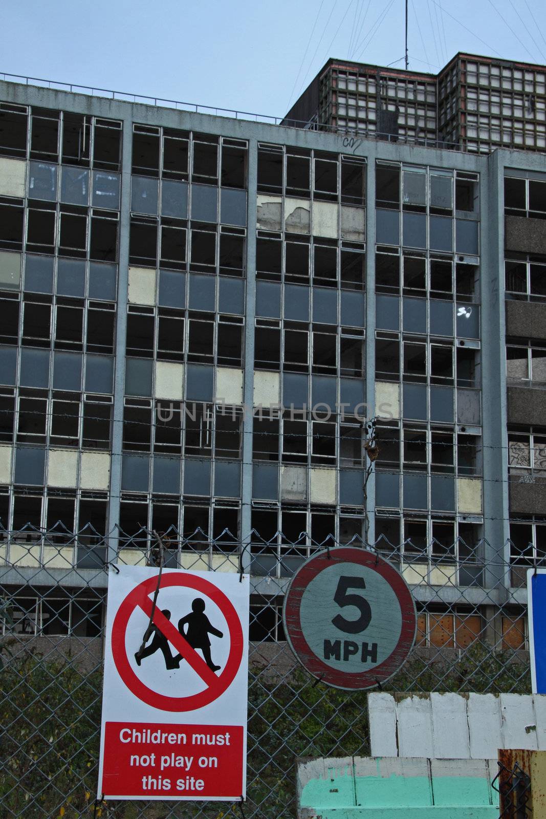 Warning signs outside abandoned buildings in Bristol by pjhpix