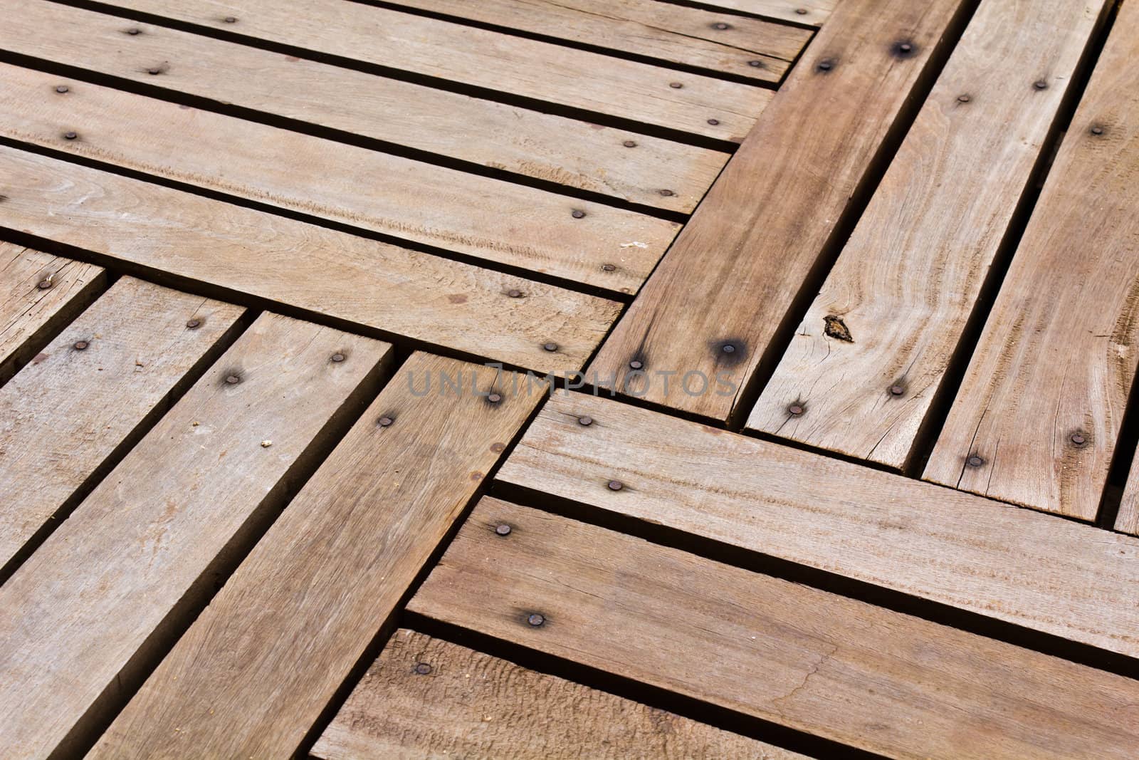 Patterns and textures of a wooden planks pavement