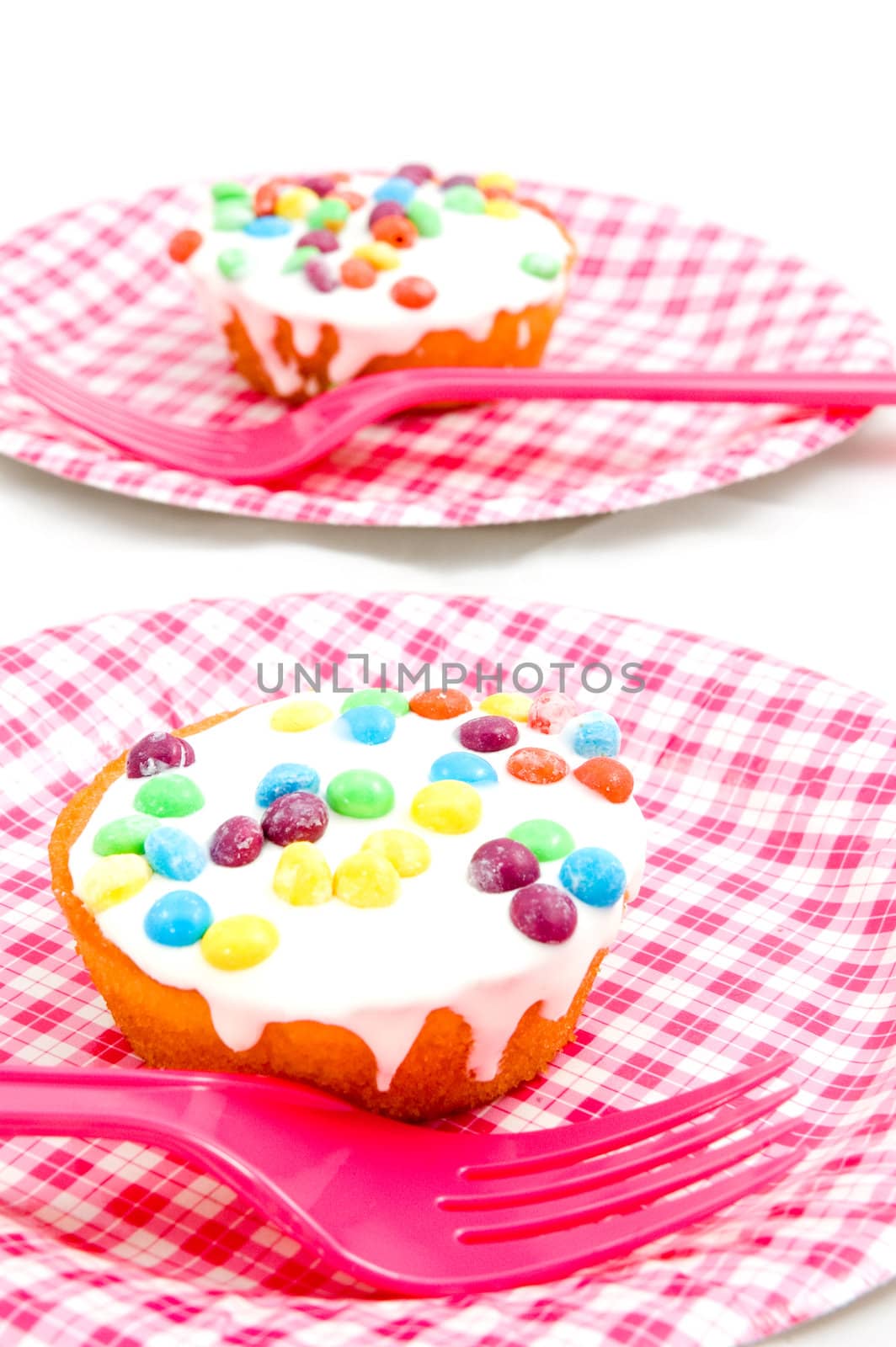 Birthday cupcake witch candies on a plate isolated