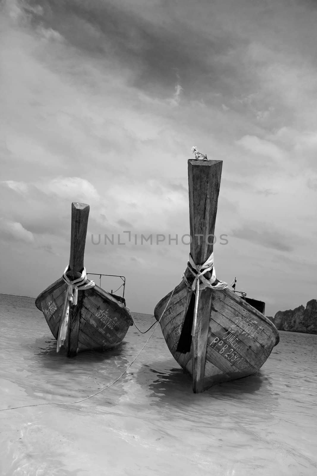 Longtailboat tied up at the beach in Thailand 