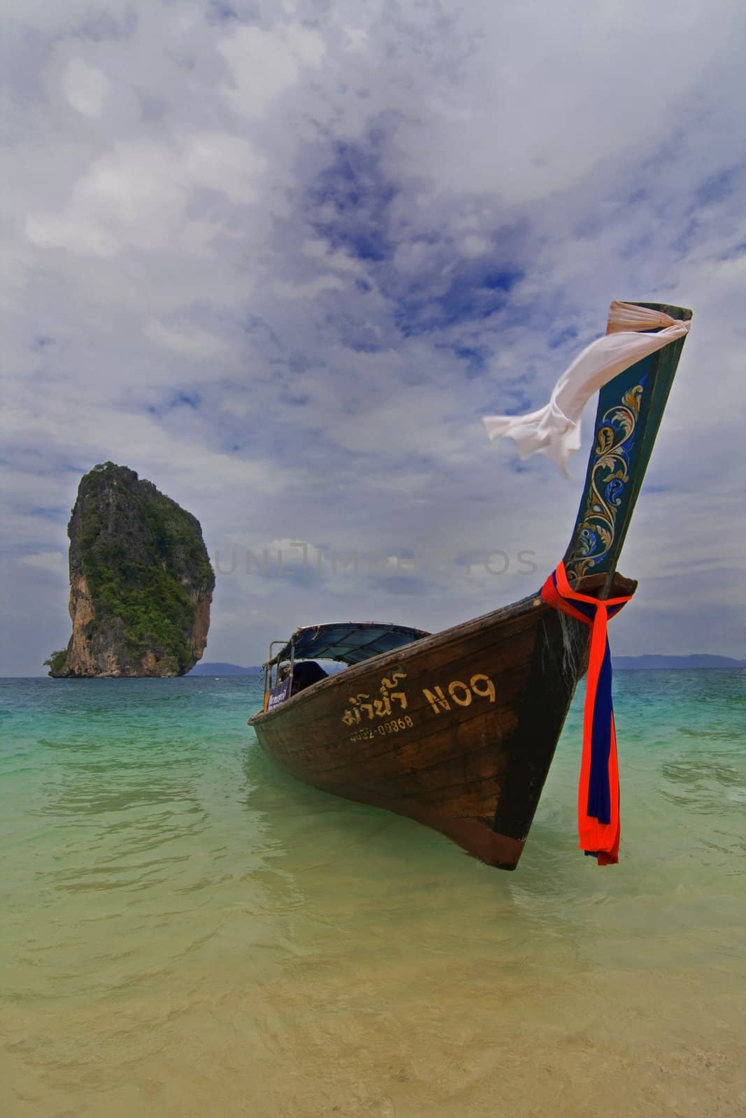 Longtailboat tied up at the beach in Thailand 