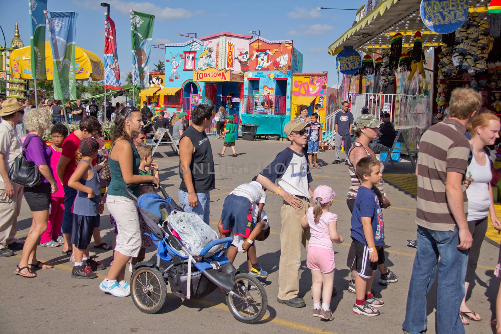 People lined up to get on the many rides at the 2011 Queen City Ex