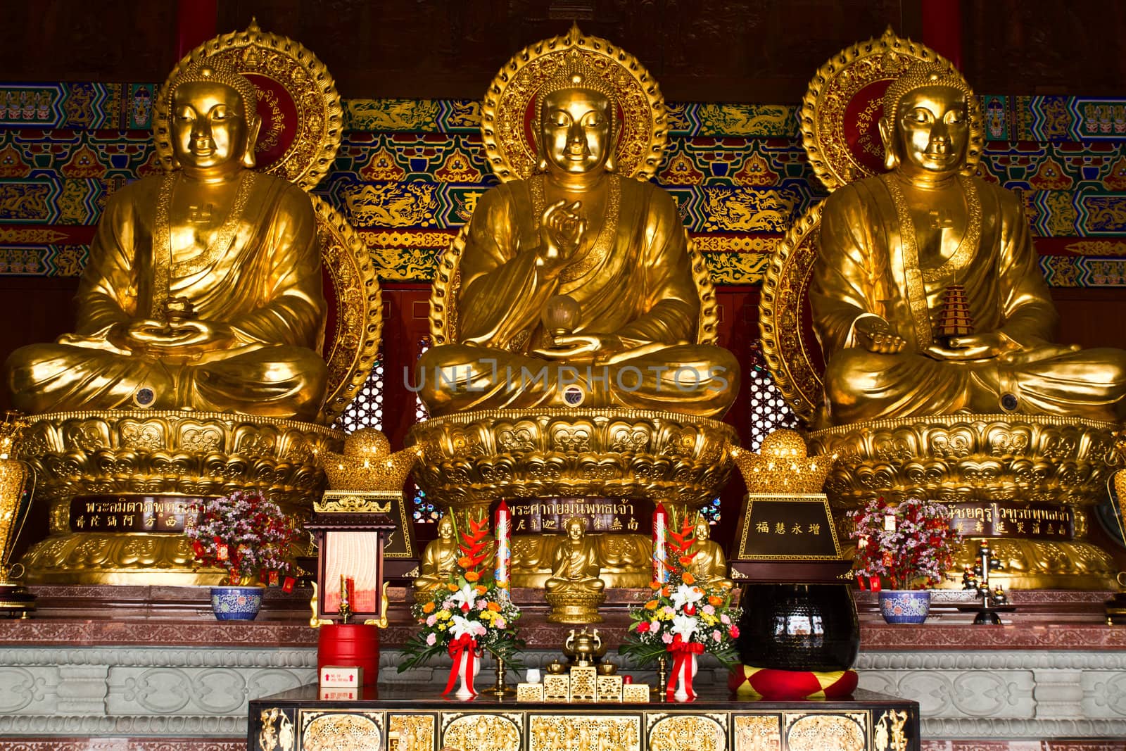 Three Buddhas in the Chinese temple of Thailand by lavoview