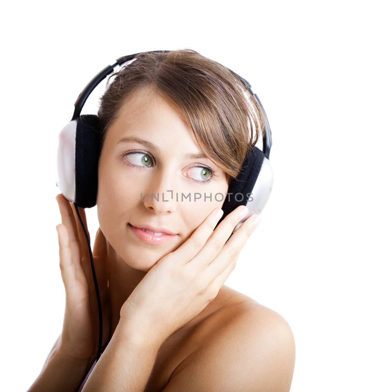 Beautiful young woman listen music with headphones, isolated on white