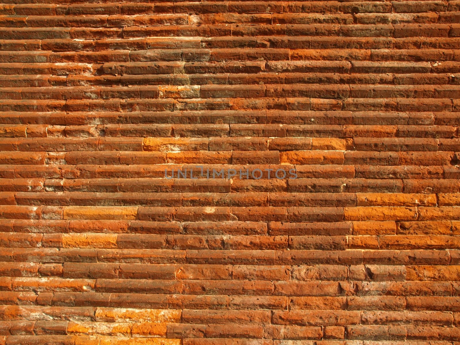 Ancient roman brick wall useful as a background