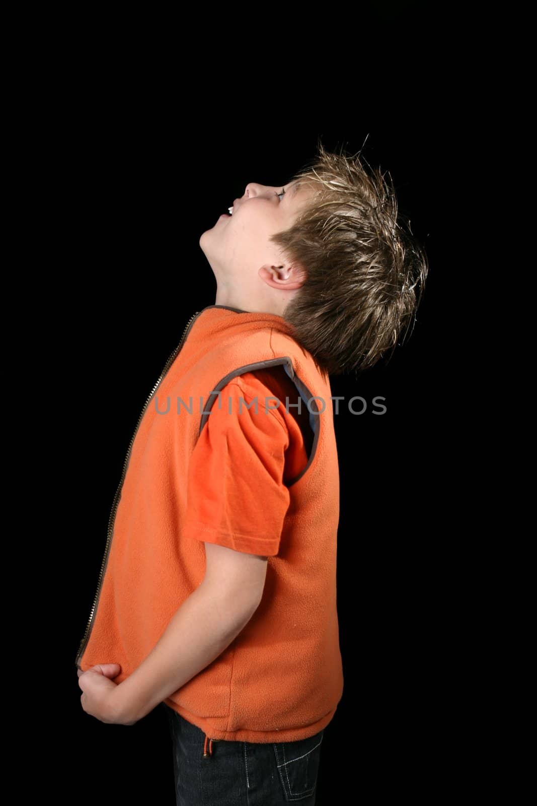 A young boy looking up with wonder