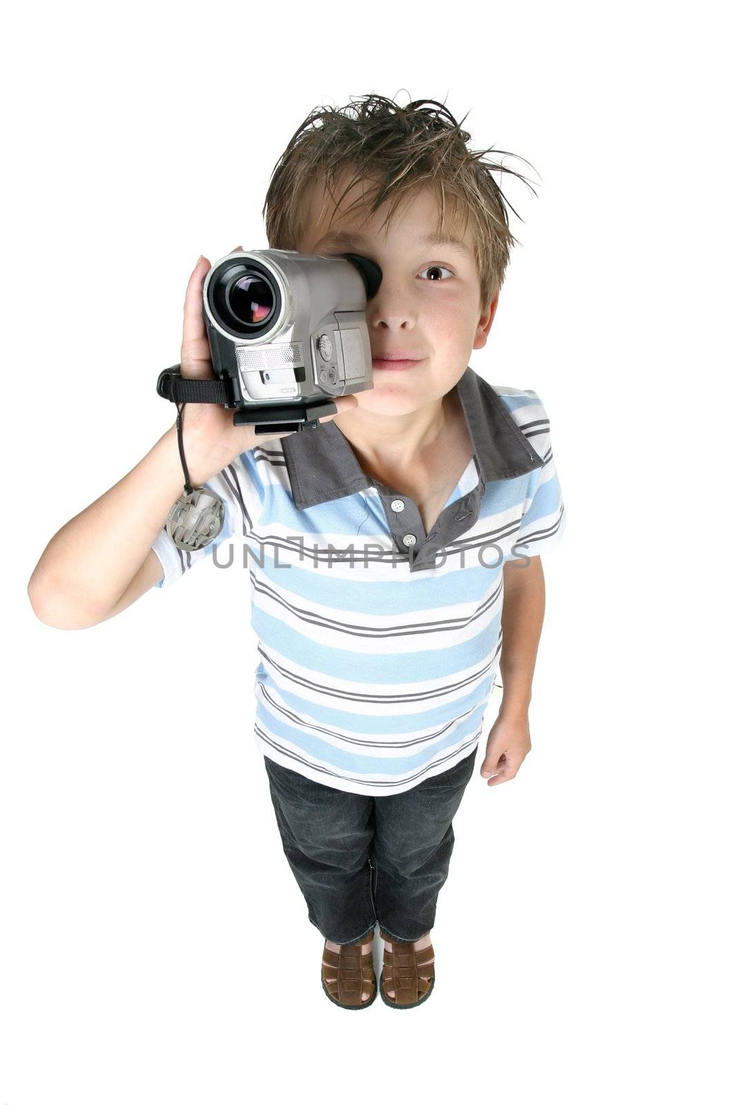 A boy recording videos or taking pictures using a digital video camera,  above perspective.
