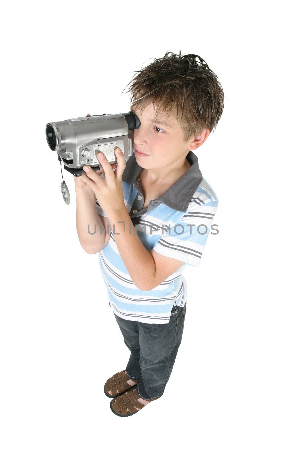 Stamding boy filming with a digital video camera.   White background,