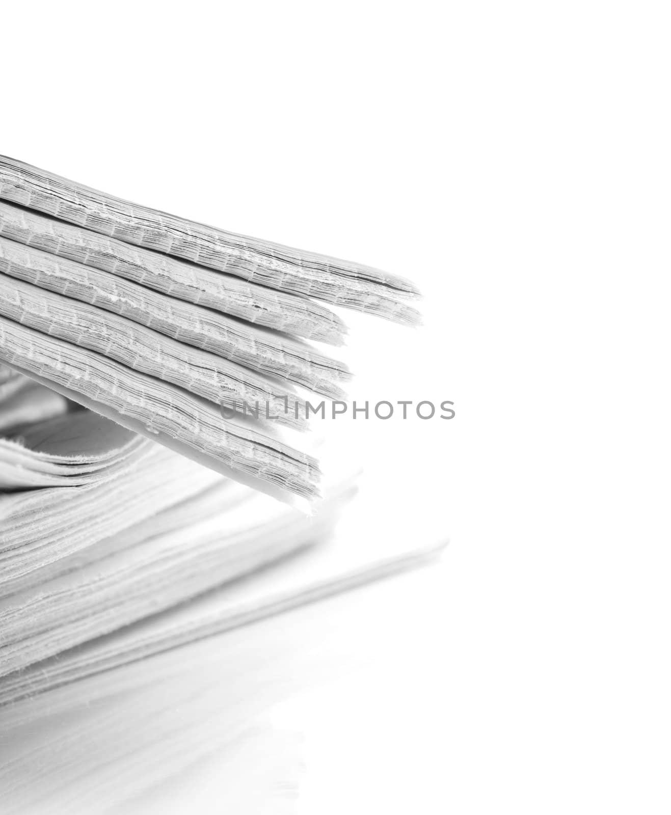 pile of news papers on white background