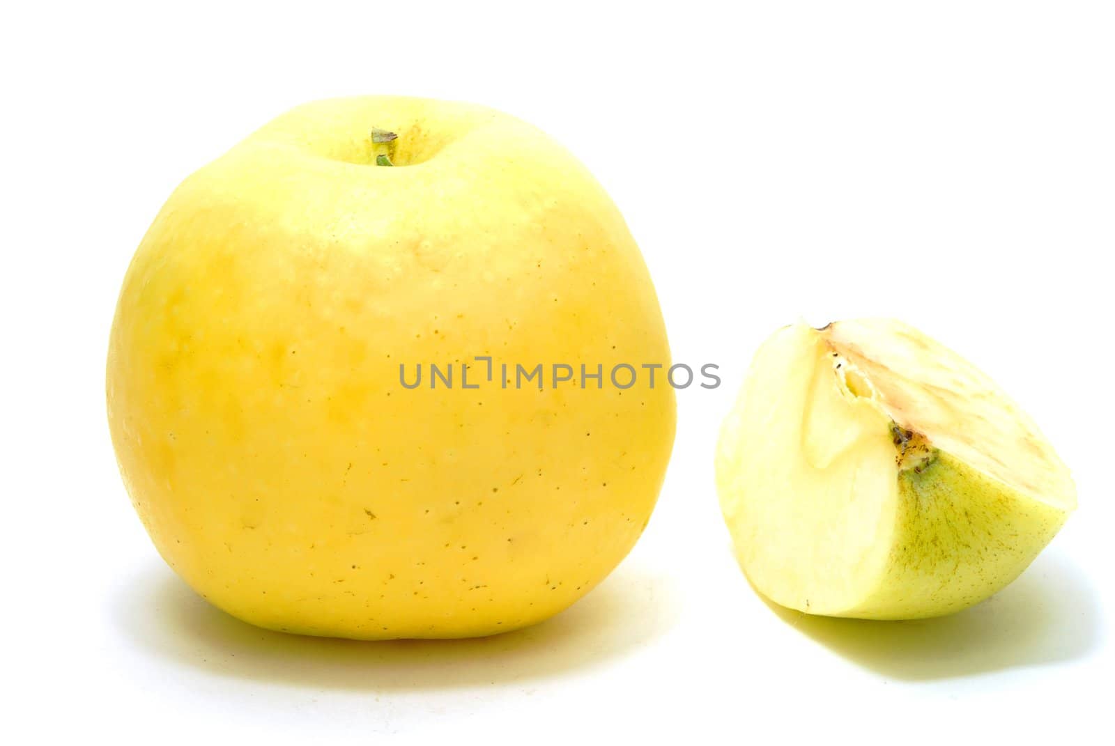 Yellow Apple with Part of Apple Isolated on White Background with Shadow