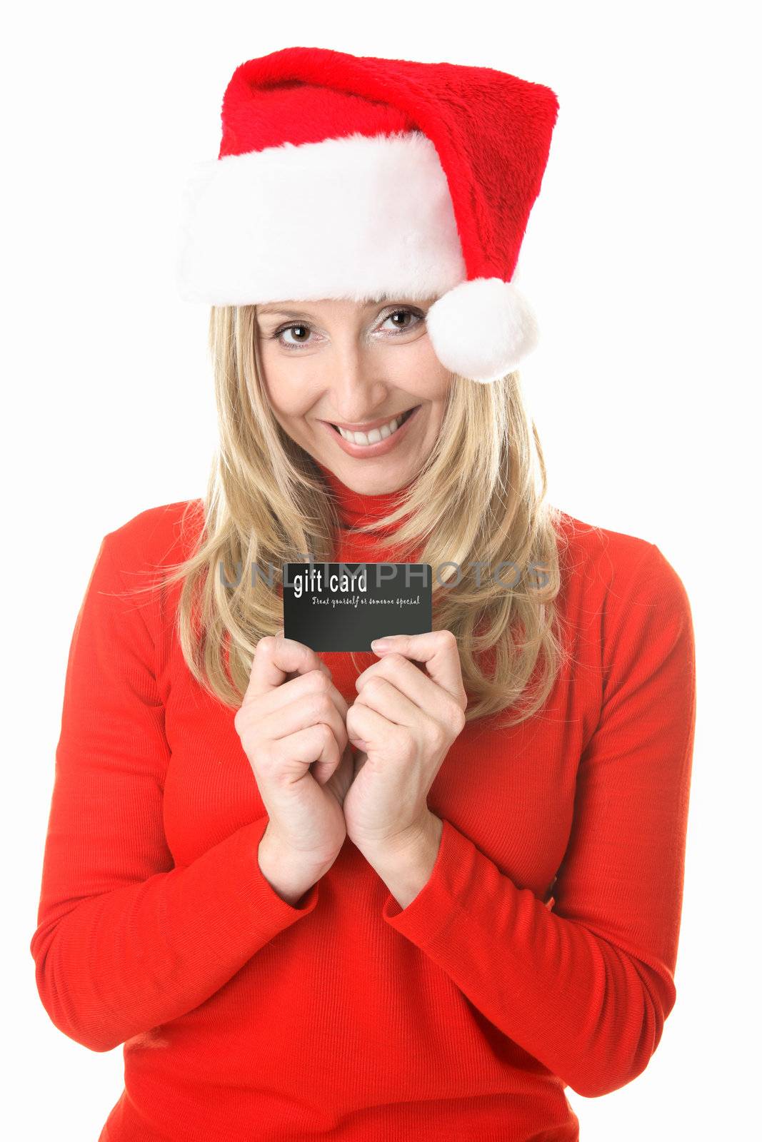 Girl wearing a festive  santa hat ready to spend some money, holding a gift card, store card or credit or debit card or other membership  or business card.  Insert your own card or replace my text with your own message.