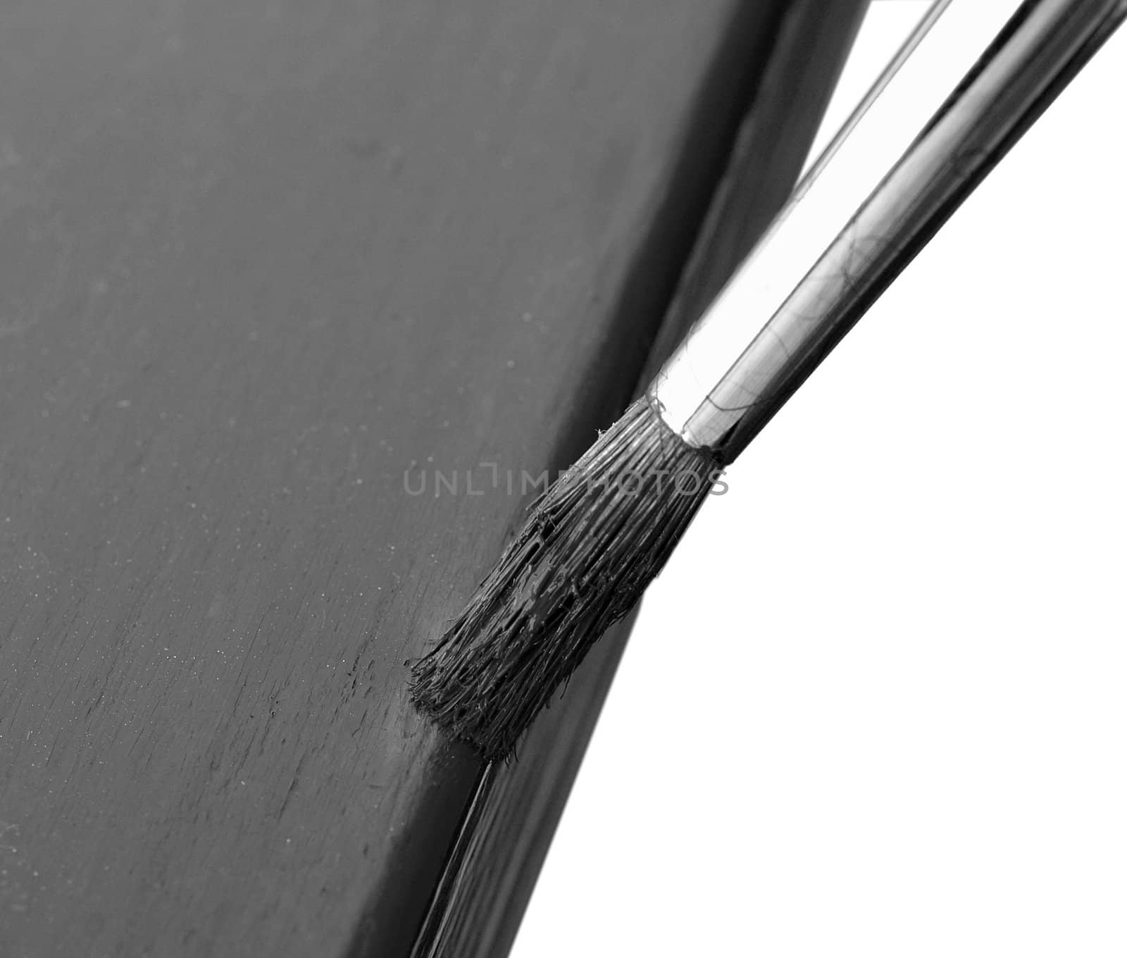 Brush painting metal fence, isolated over white
