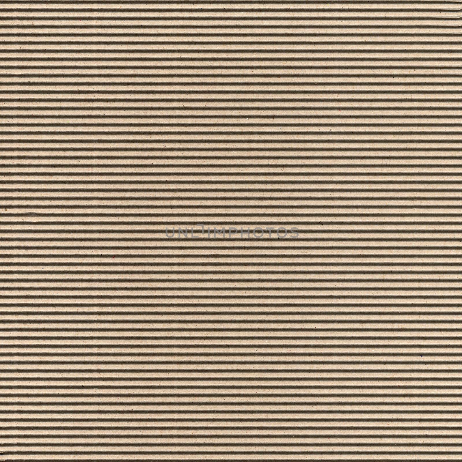 Seamless brown corrugated cardboard sheet useful as a background