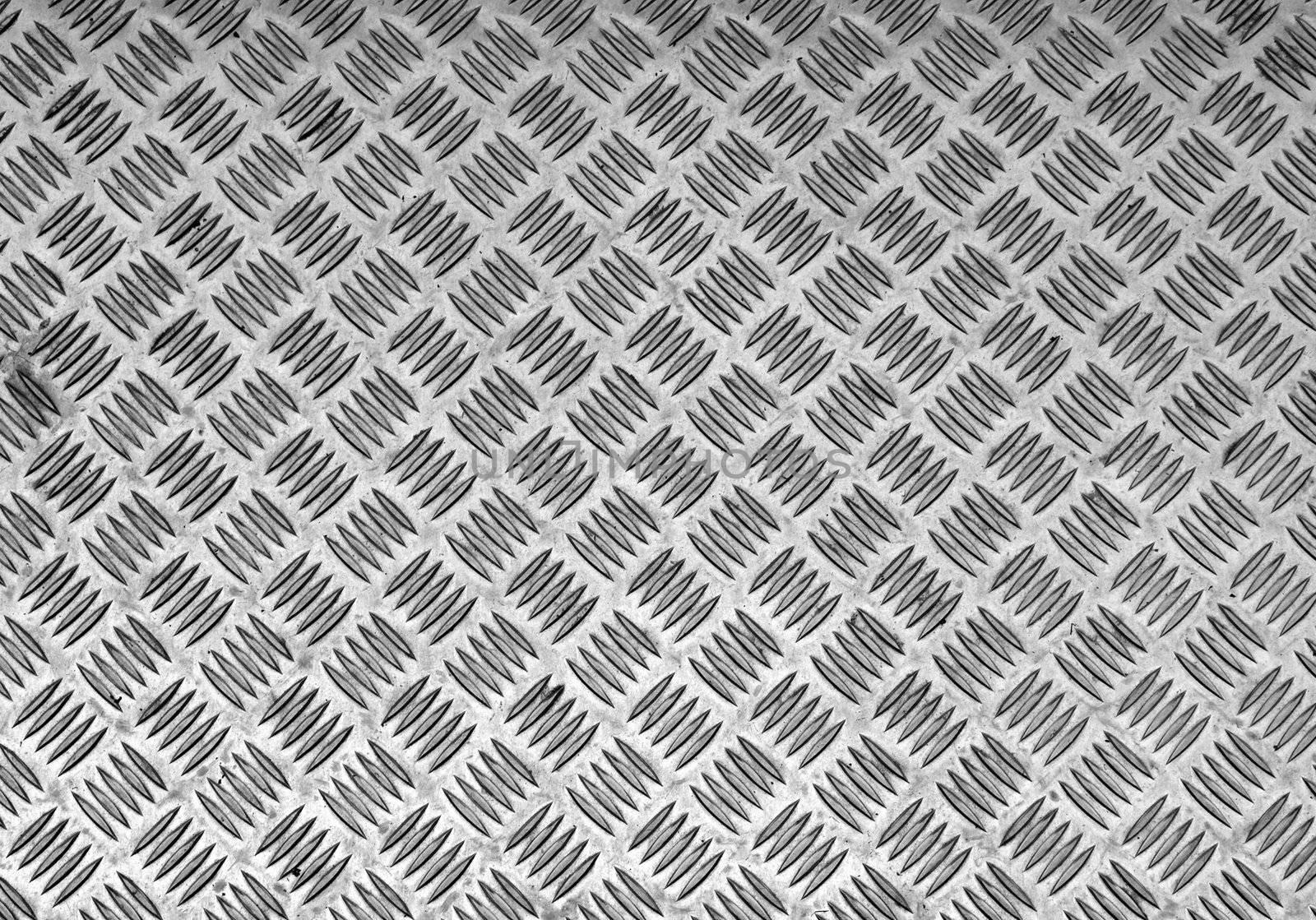 Diamond steel plate useful as a background