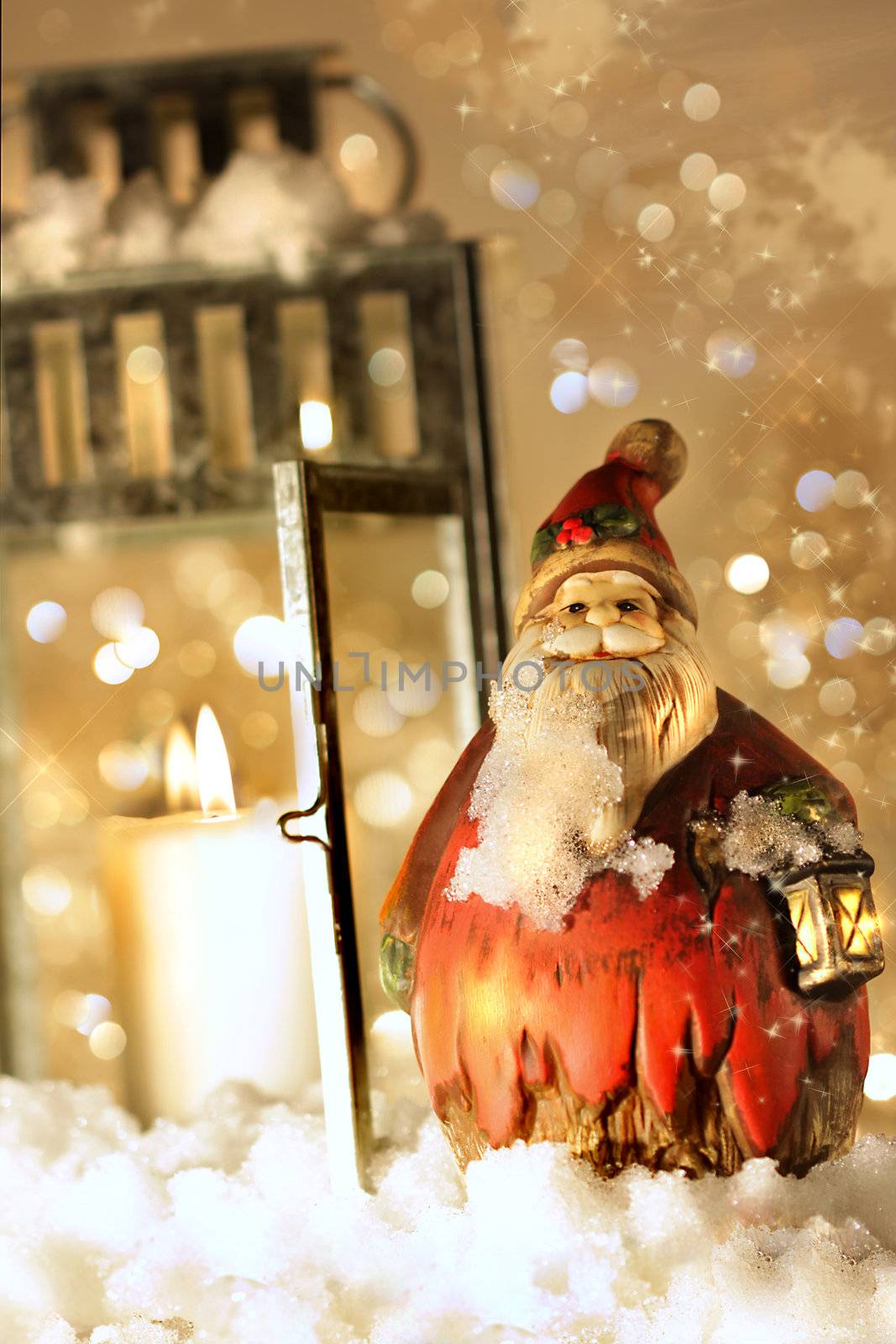 Brightly lit lantern in the snow with little Santa