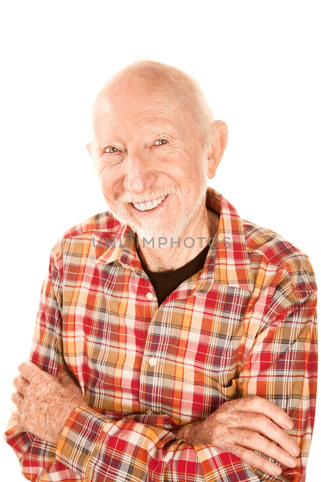 Handsome senior man with gray stubble smiling broadly