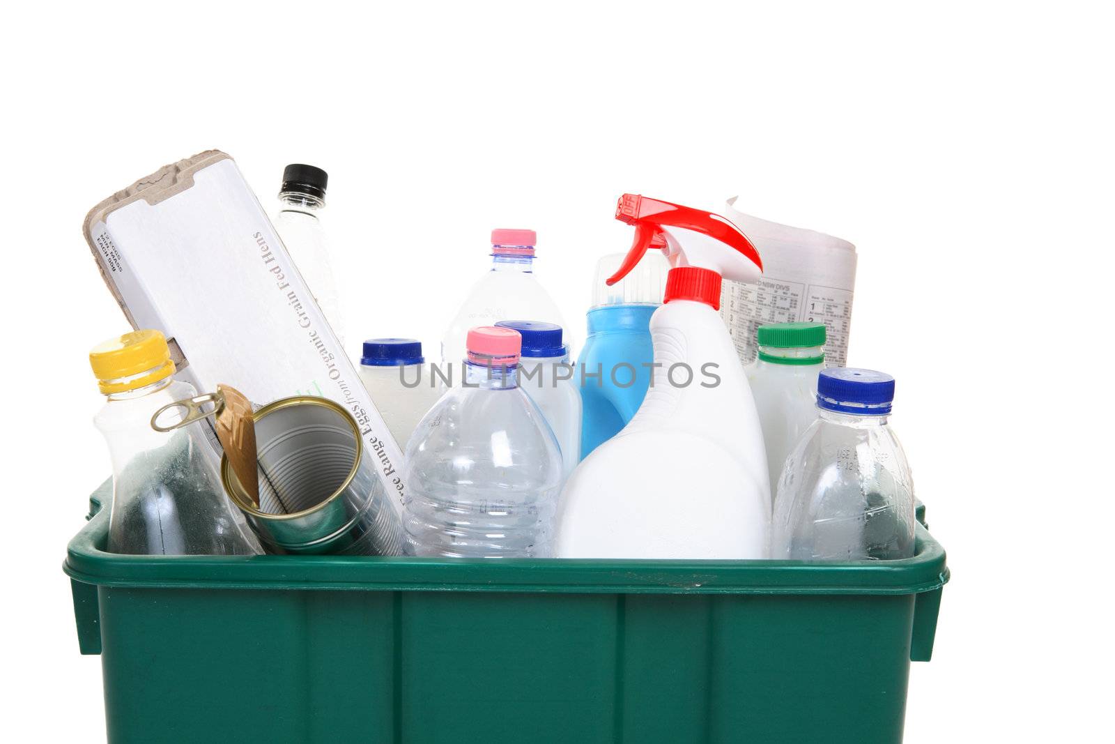 A collection of empty bottles, cans, paper and other containers in a recycling bin