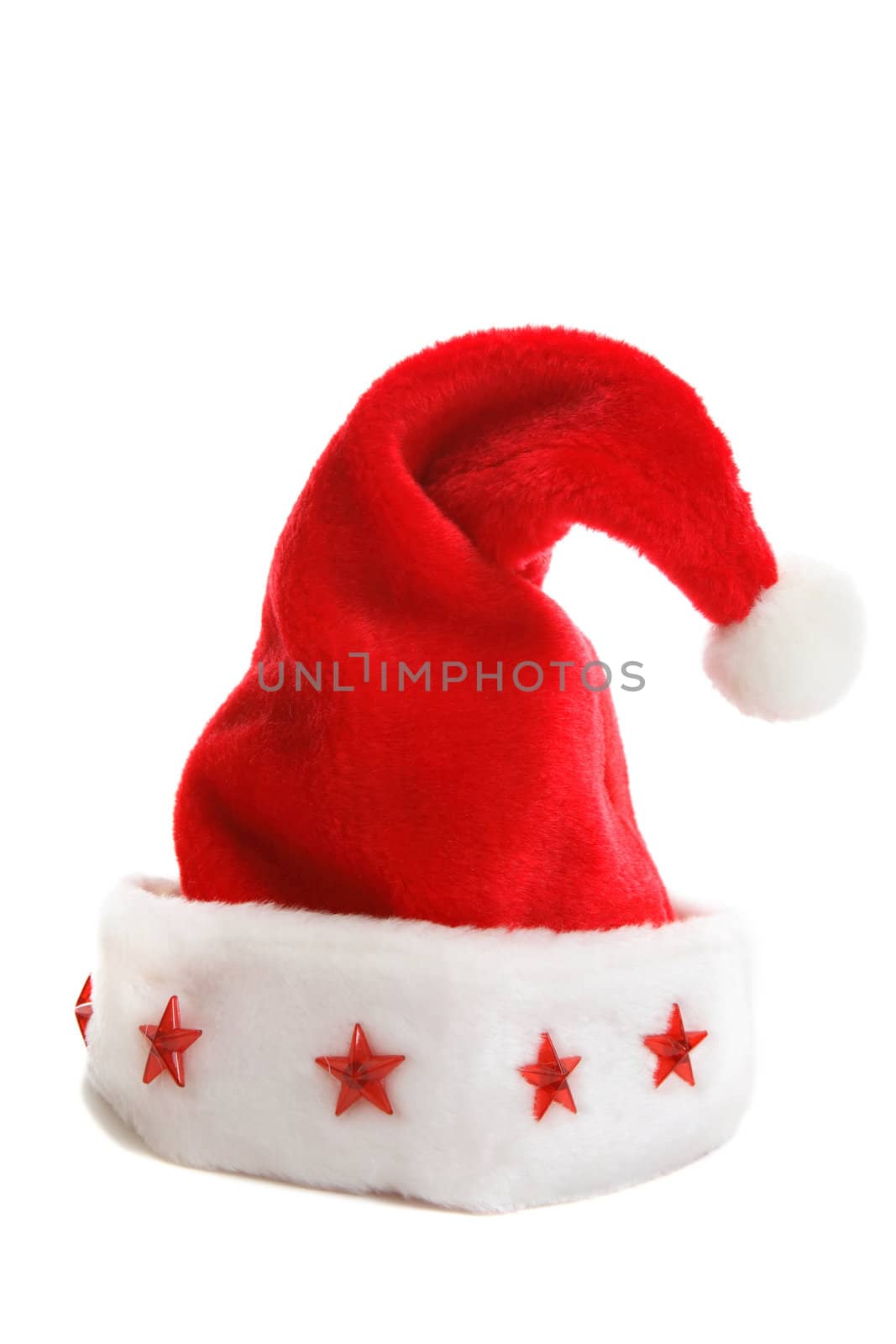 A Santa hat with red stars decorating the rim sitting on a  plain white backdrop