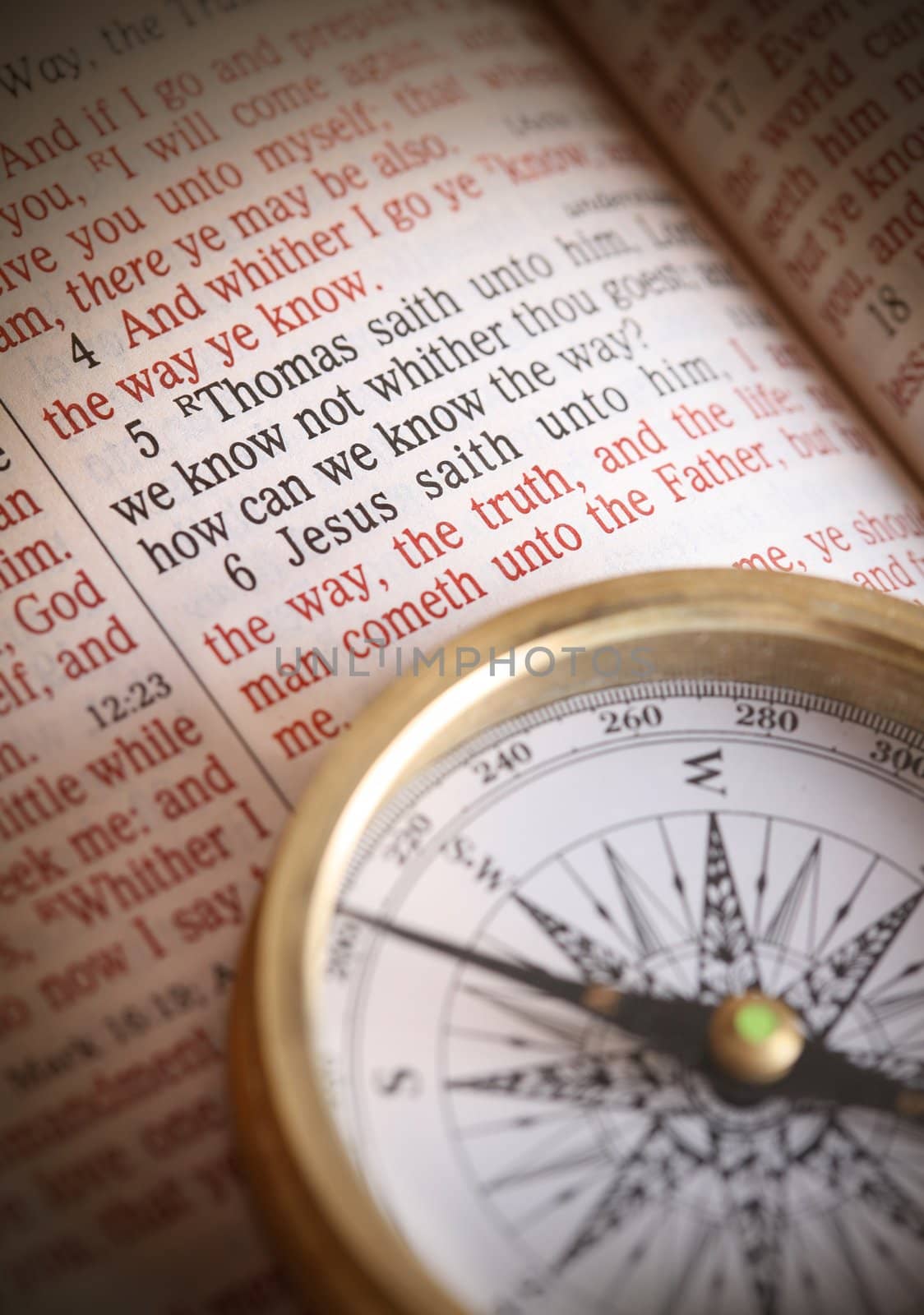 Compass and bible depicting popular bible verse John 14:5-6  How do we know the way.  I am the way the truth and the life....etc.   Focus to bible text