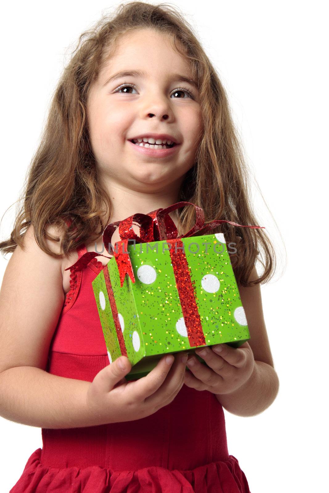 Exuberant happy child holding a present.