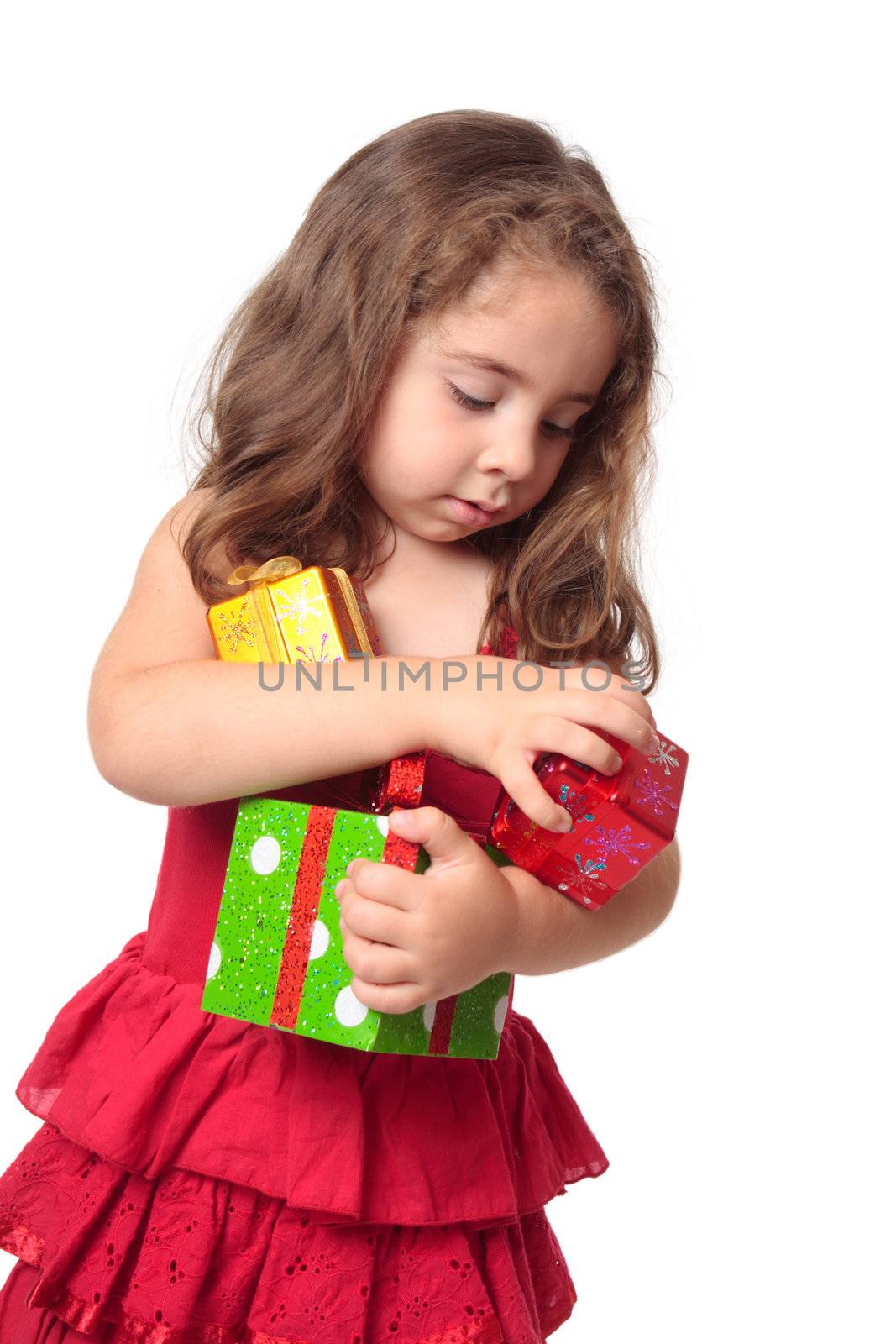 Girl holding an armful of Christmas presents by lovleah