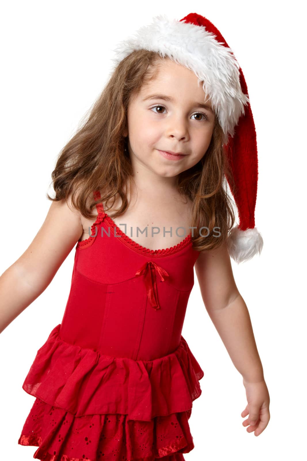 Prety girl wearing a red dress and red santa hat at Christmas