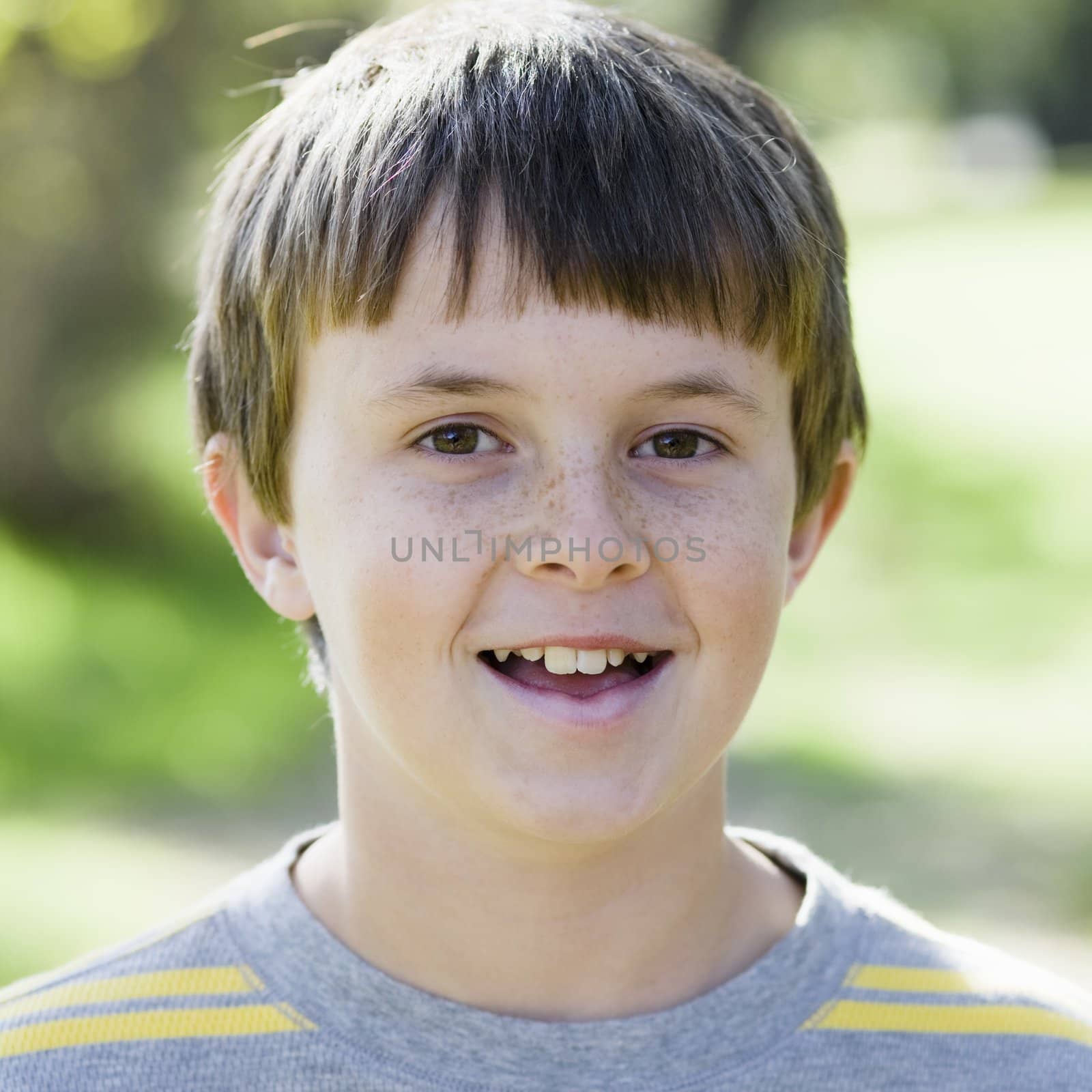 Portrait of a Cute Young Boy Smiling To Camera