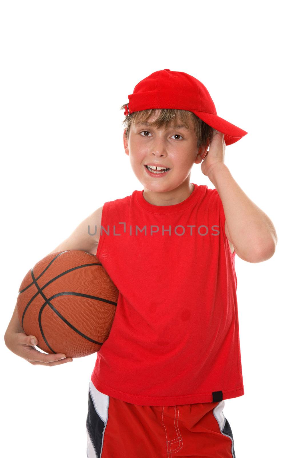 Flushed child holding a basketball aftera game.