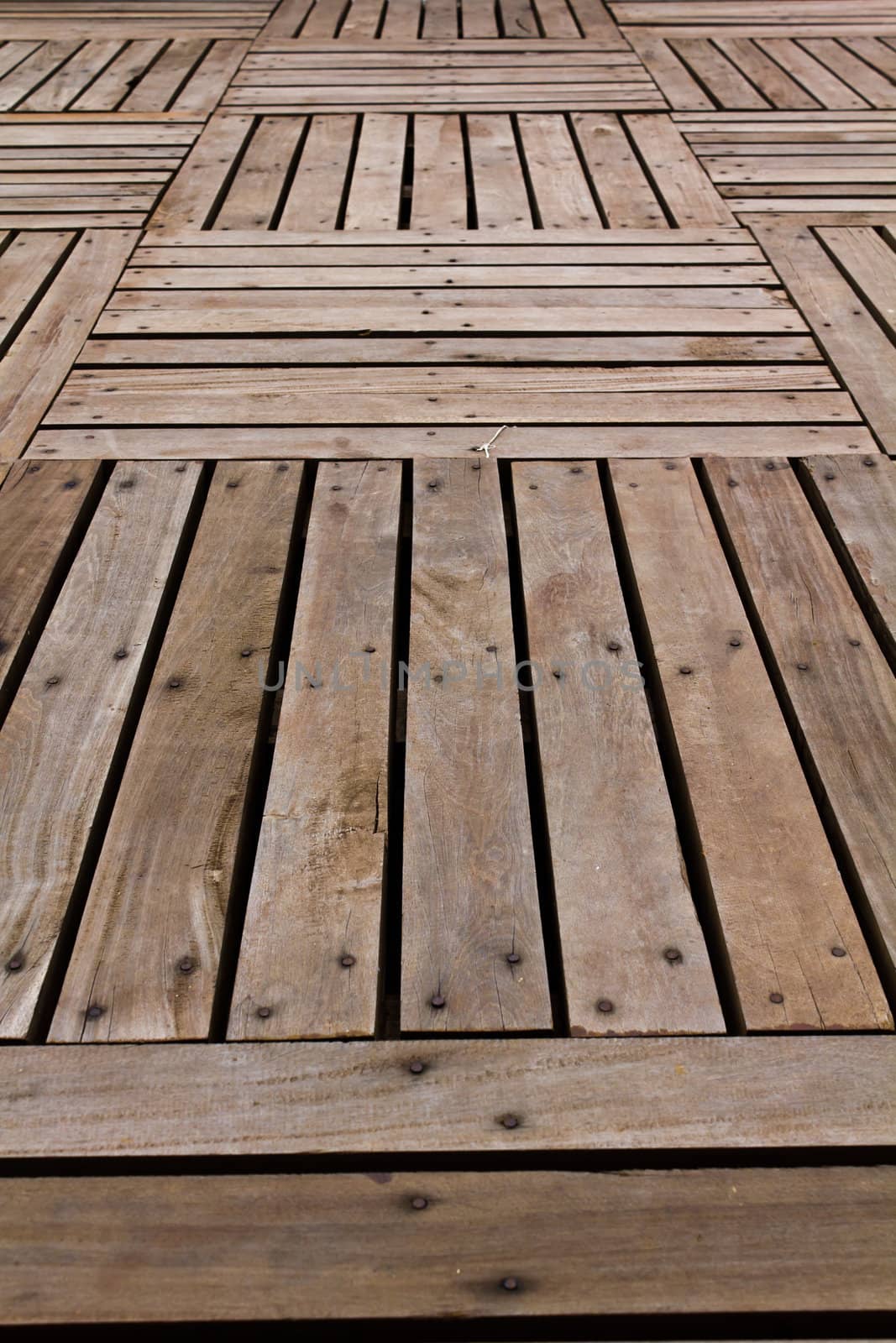 Patterns and textures of a wooden planks pavement