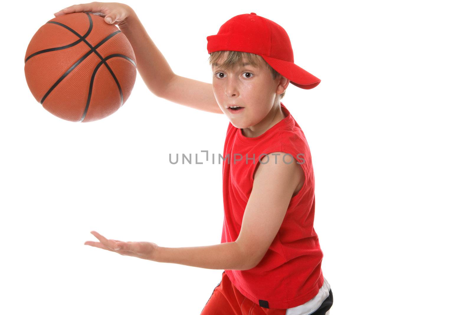 A child in action playing a game of basketball