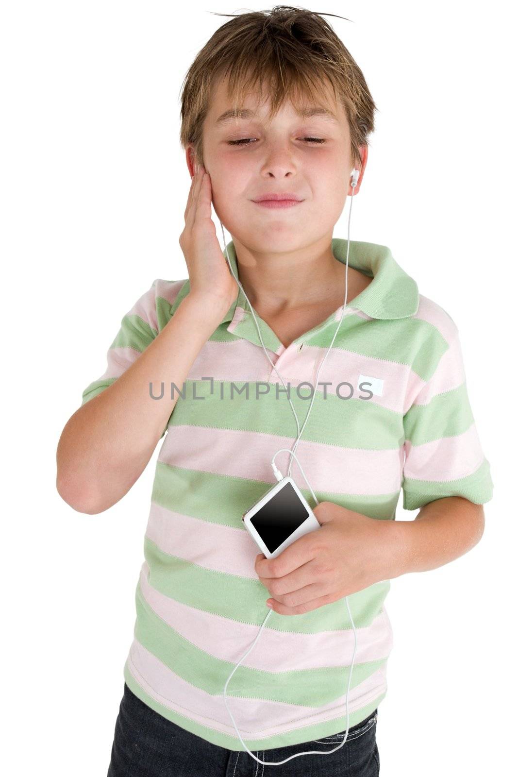 A child enjoys music from a portable player.