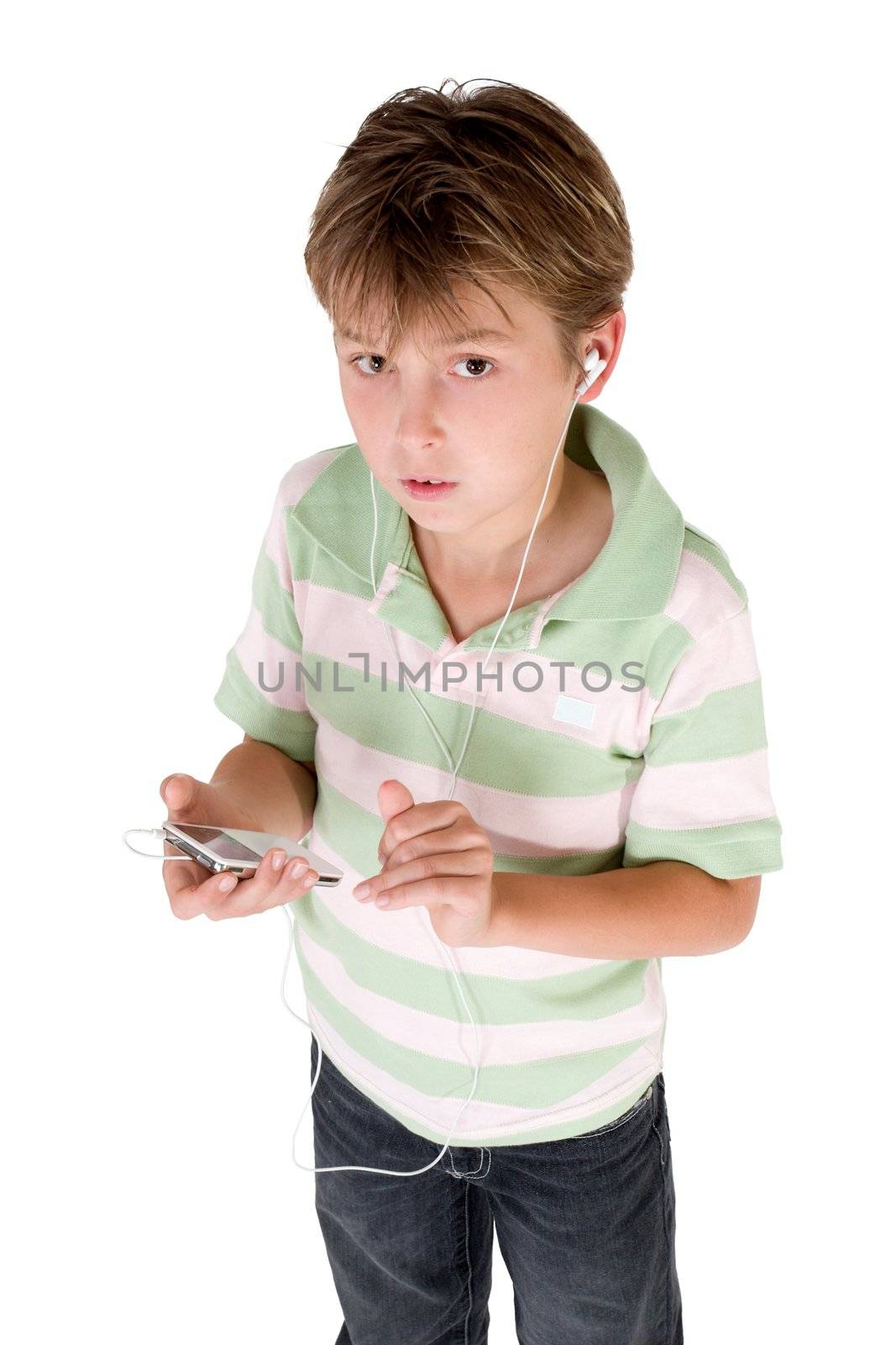 A child dressed in jeans and polo shirt holding an mp3 player.