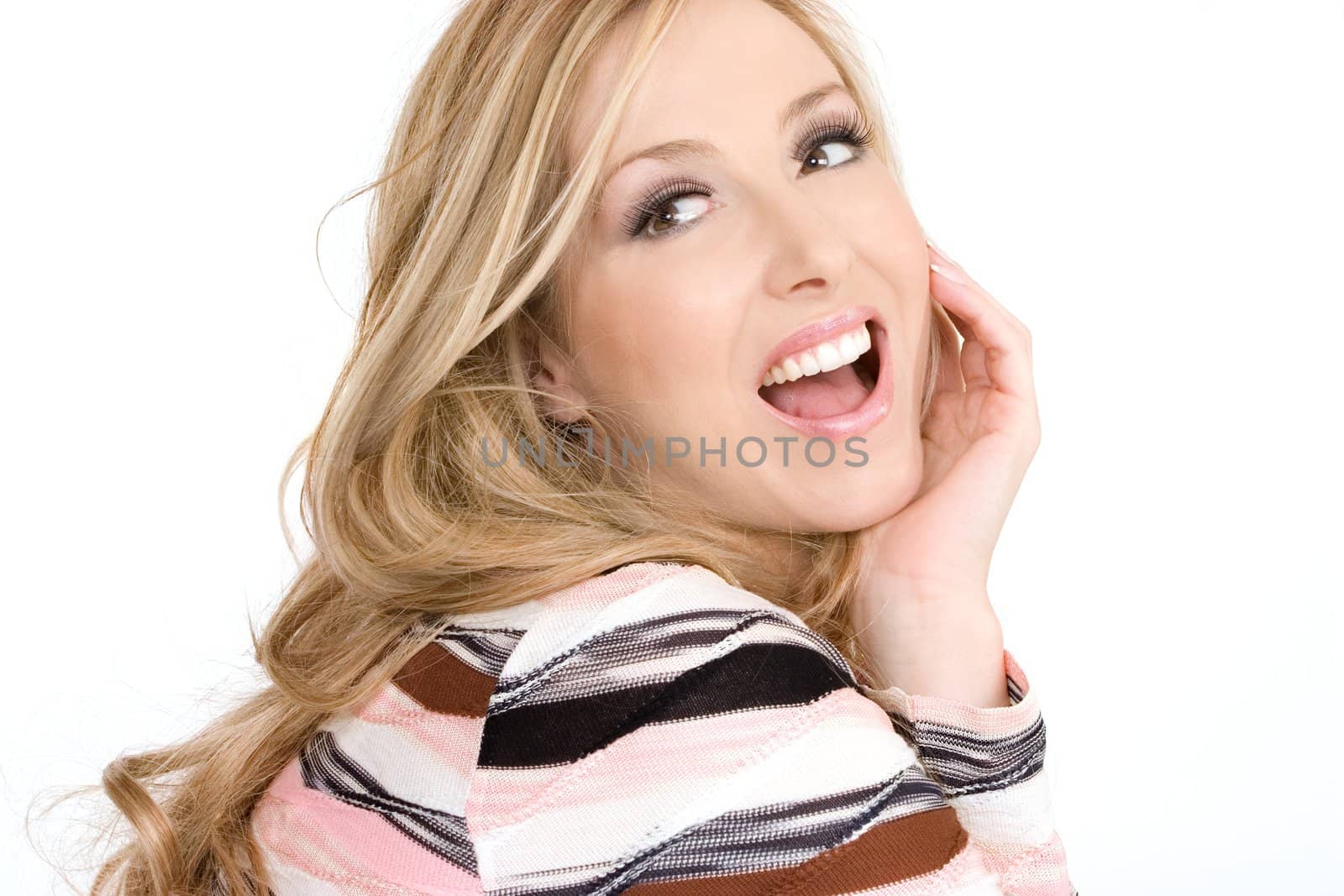 Happy joyful woman wearing makeup and with hair loose and wavy.