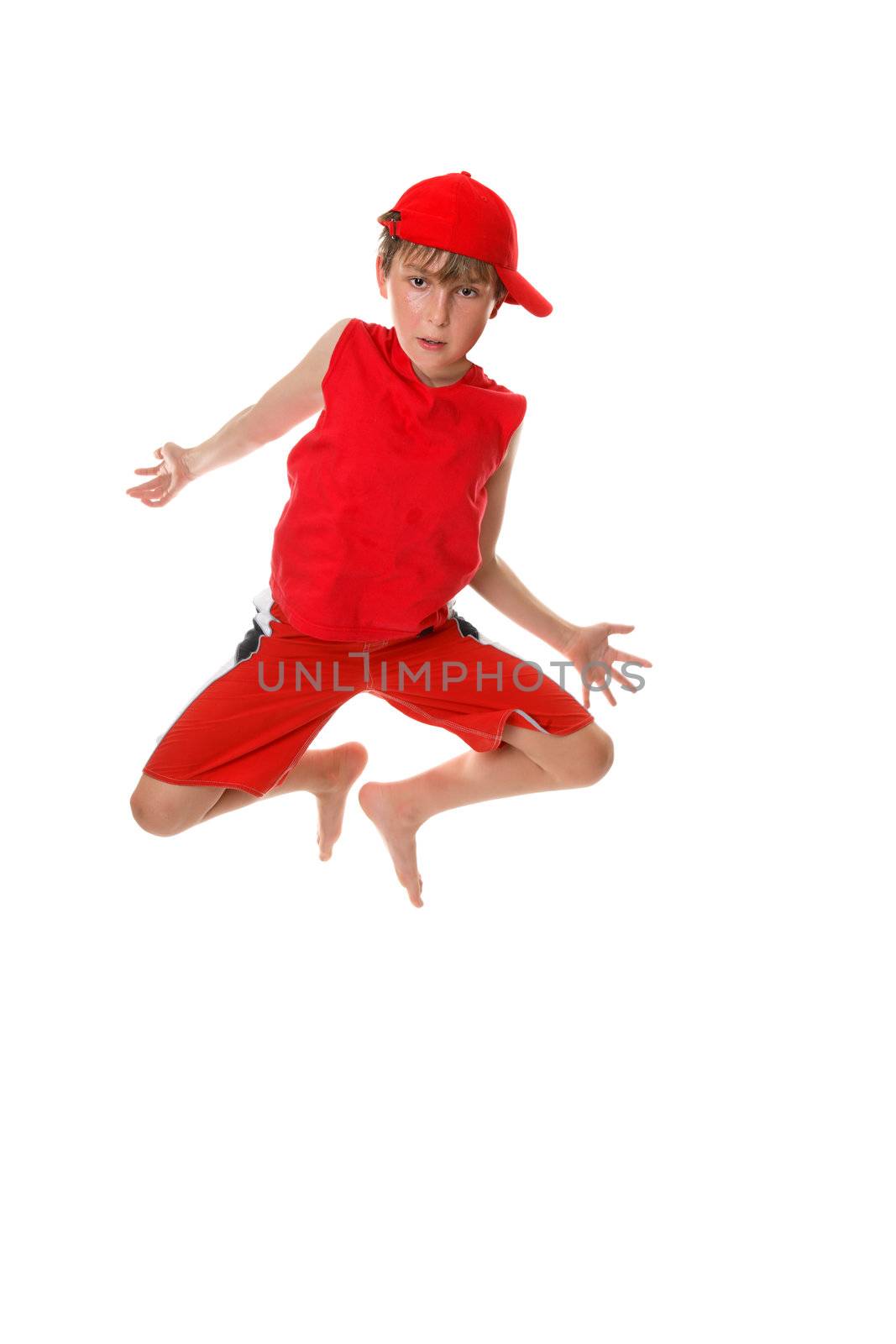 A barefoot casual boy in mid jump