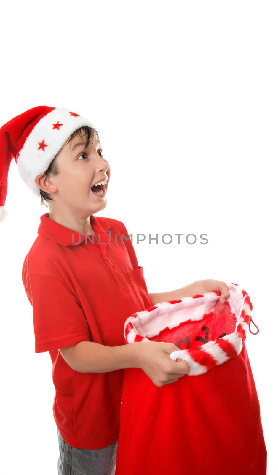 Boy with an open sack and looking up with  a gleeful expression.  Space for copy.