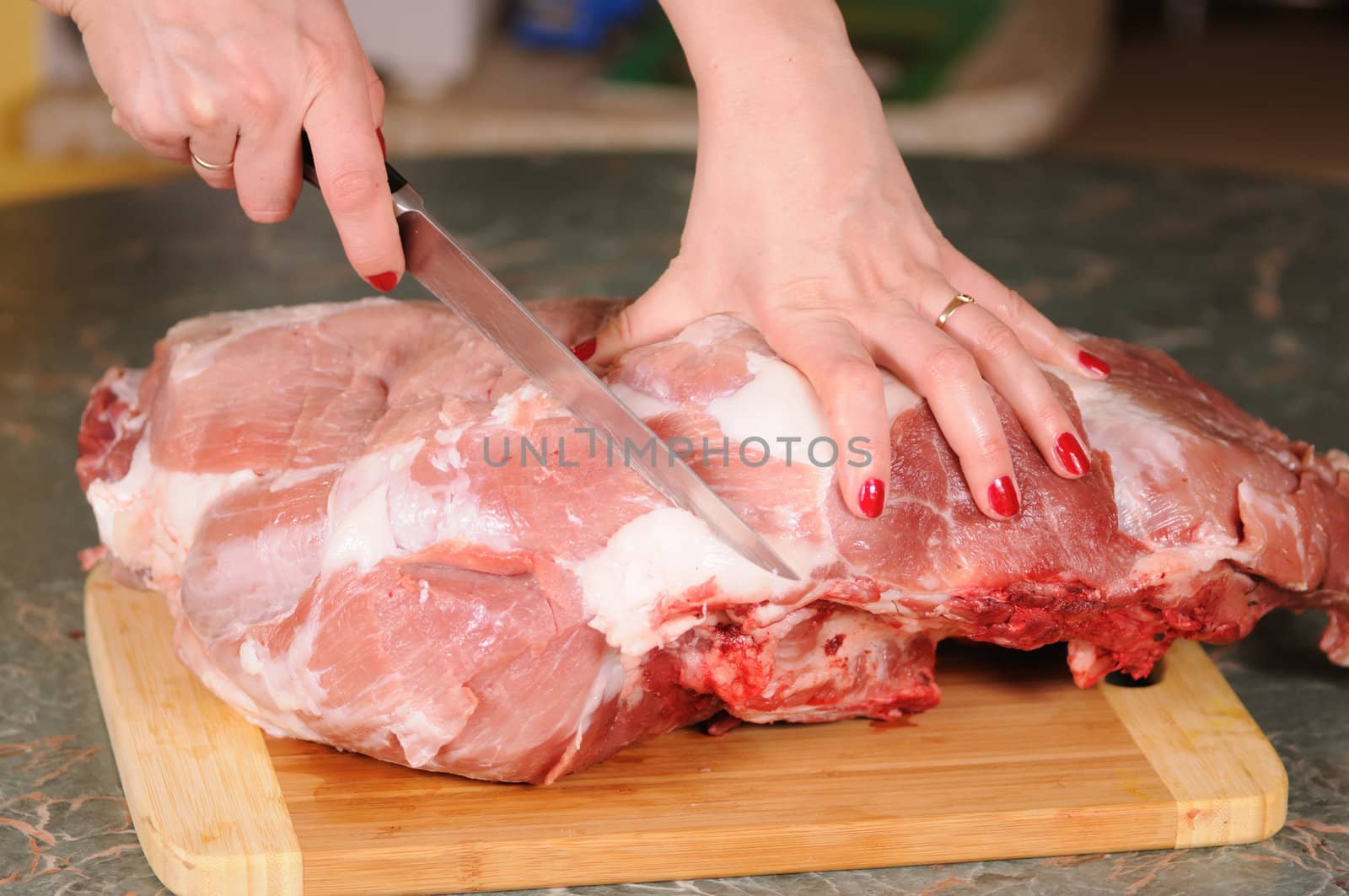 cutting of the big piece of meat