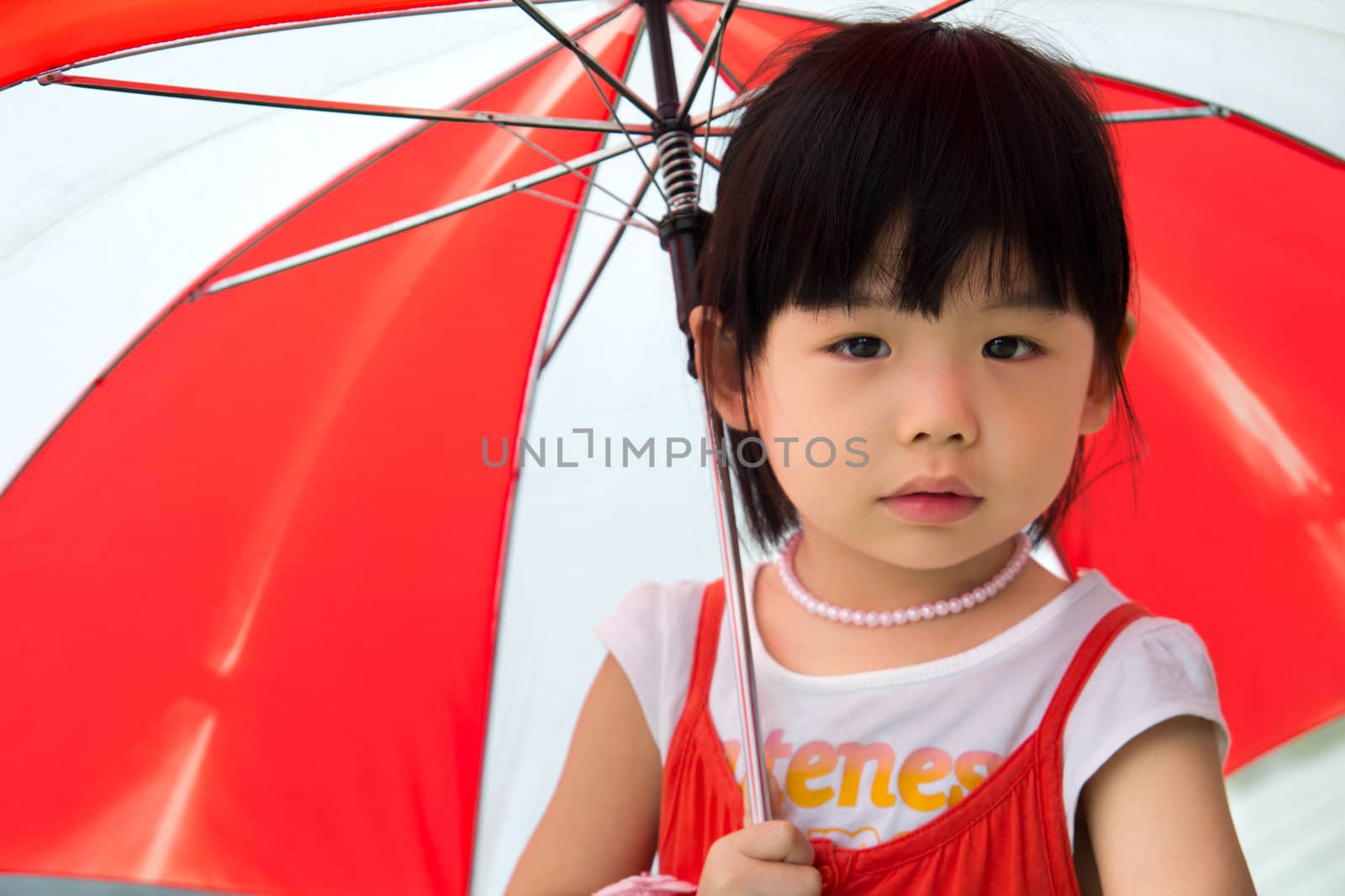 Asian child with red umbrella by Kenishirotie