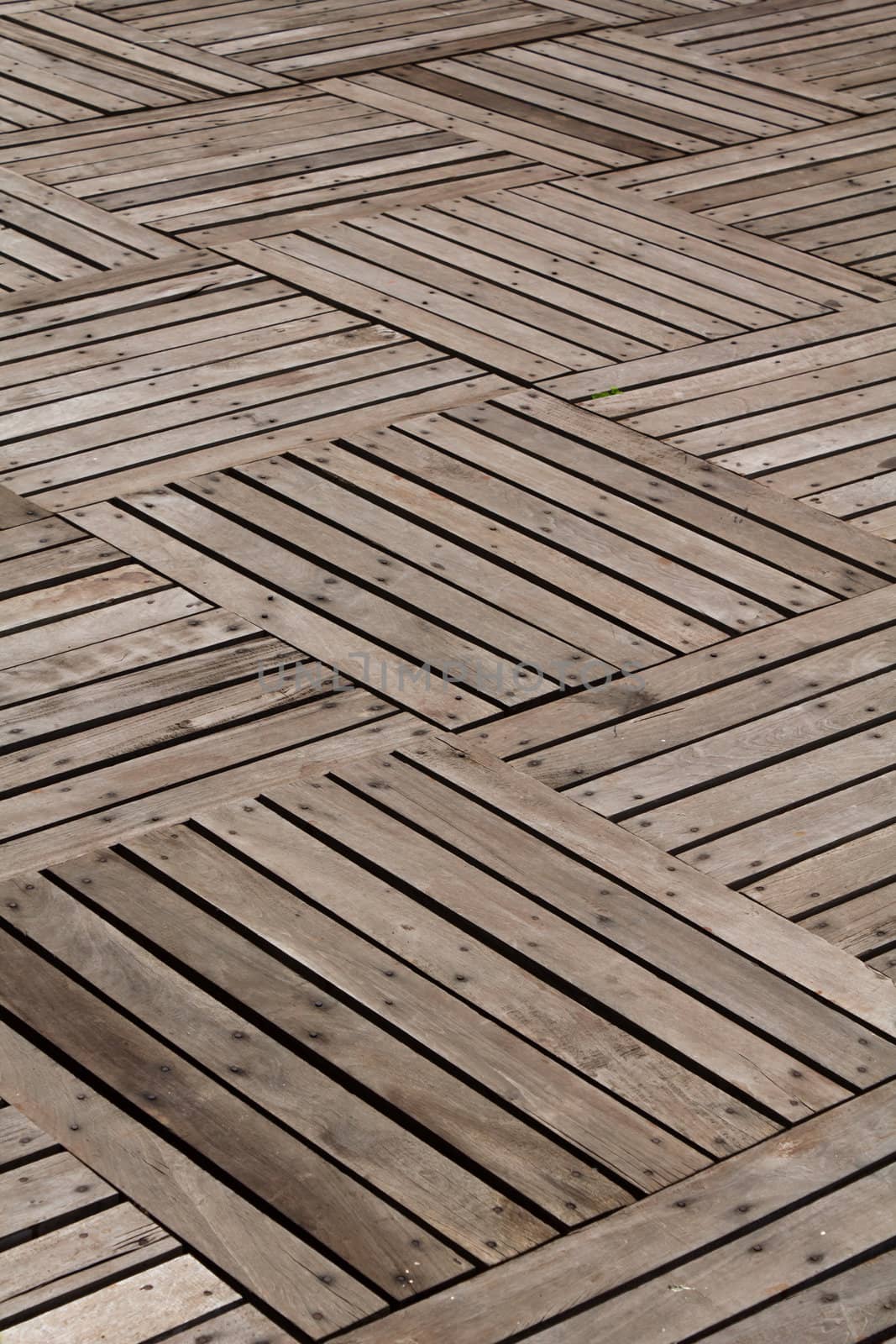 Patterns and textures of a wooden planks pavement  by lavoview