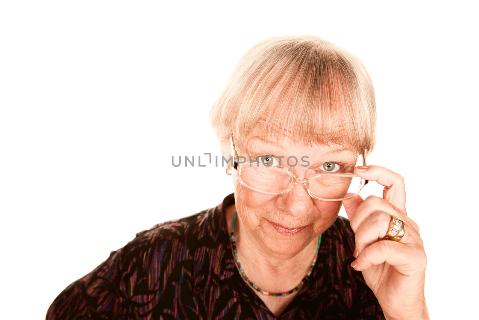Senior woman looking over the top of her glasses
