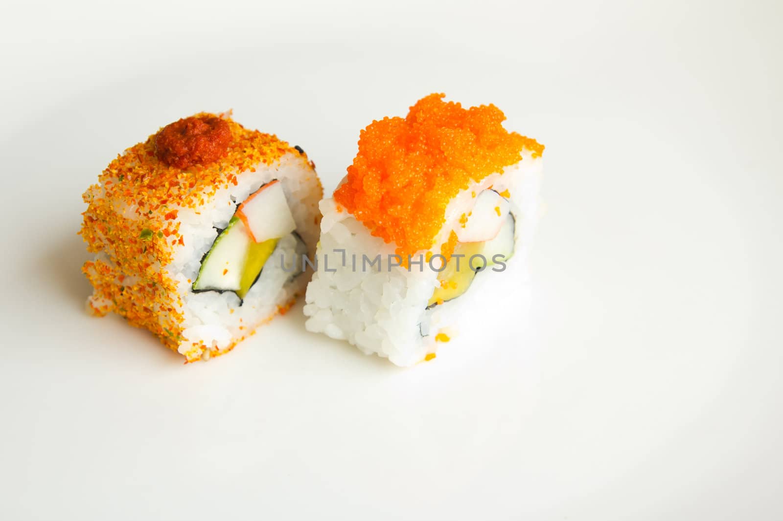 Two Japanese sushi isolated on a white plate