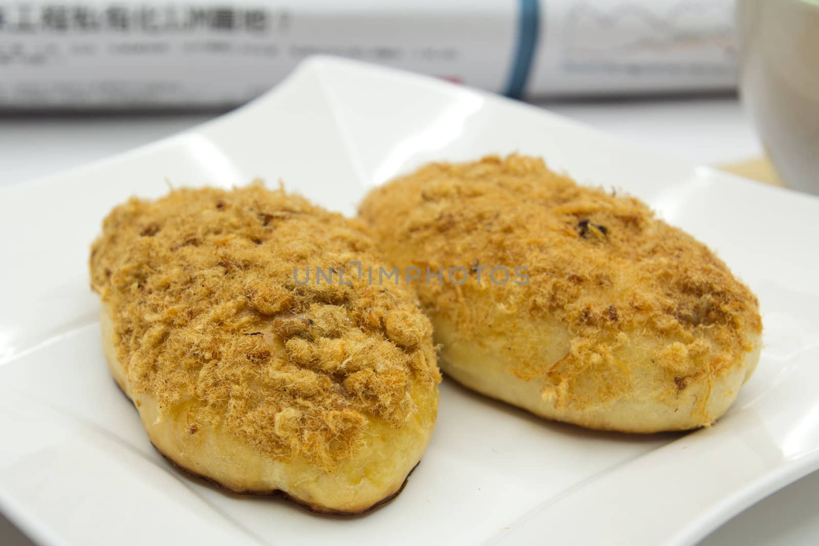 Two chicken floss buns served in a white plate