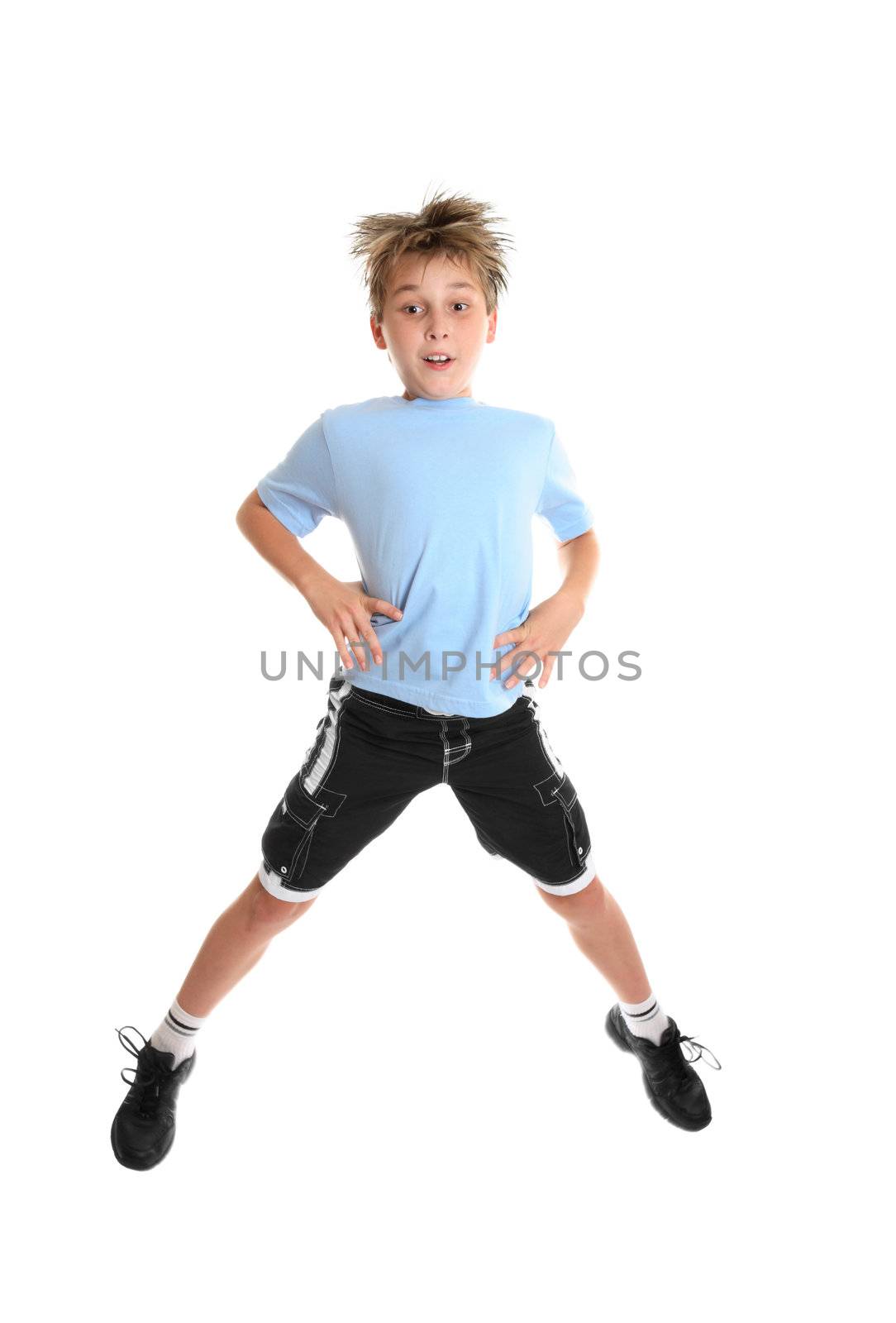 A boy doing fitness exercises on a white background.