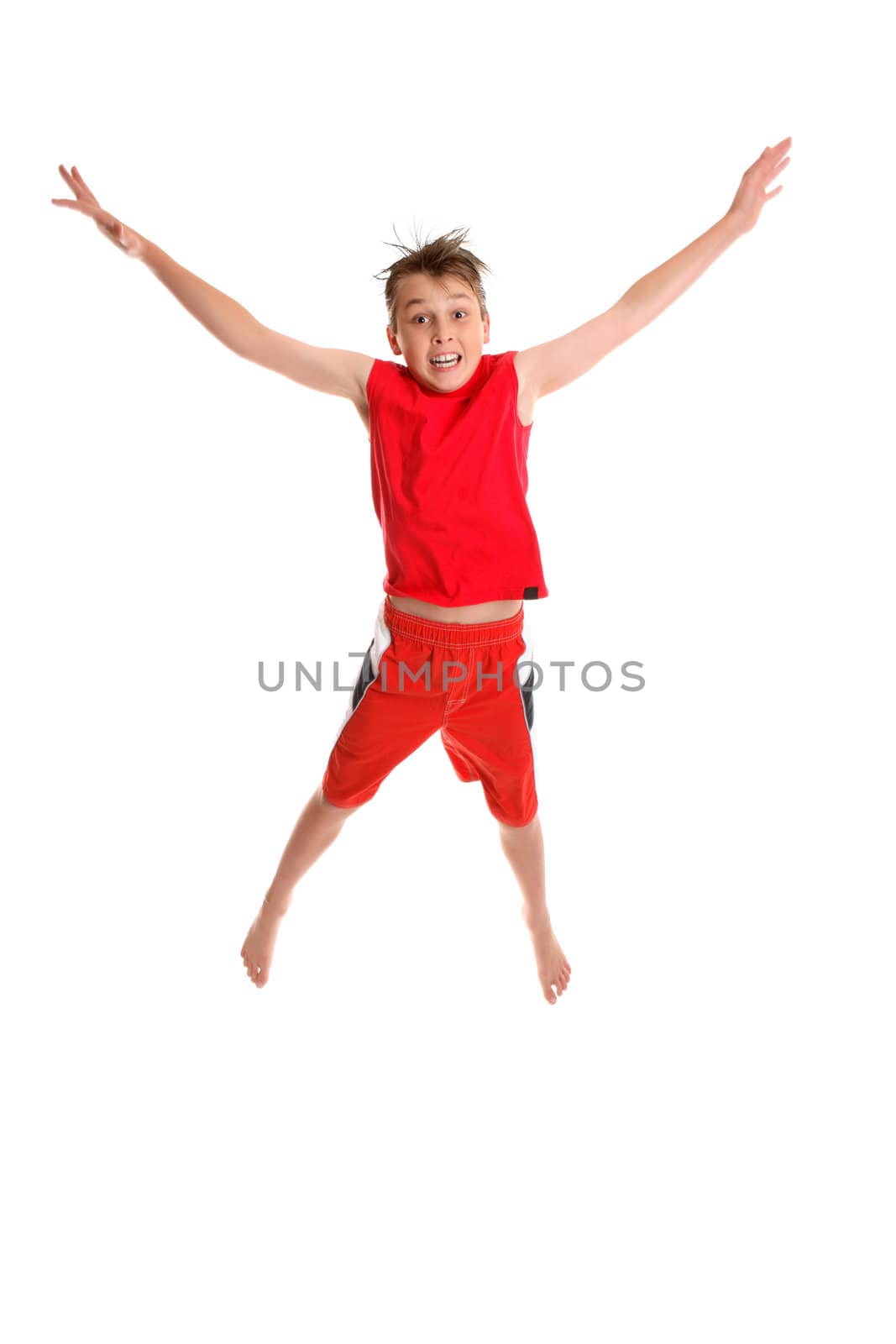 Starjump.  A young boy jumps into the air